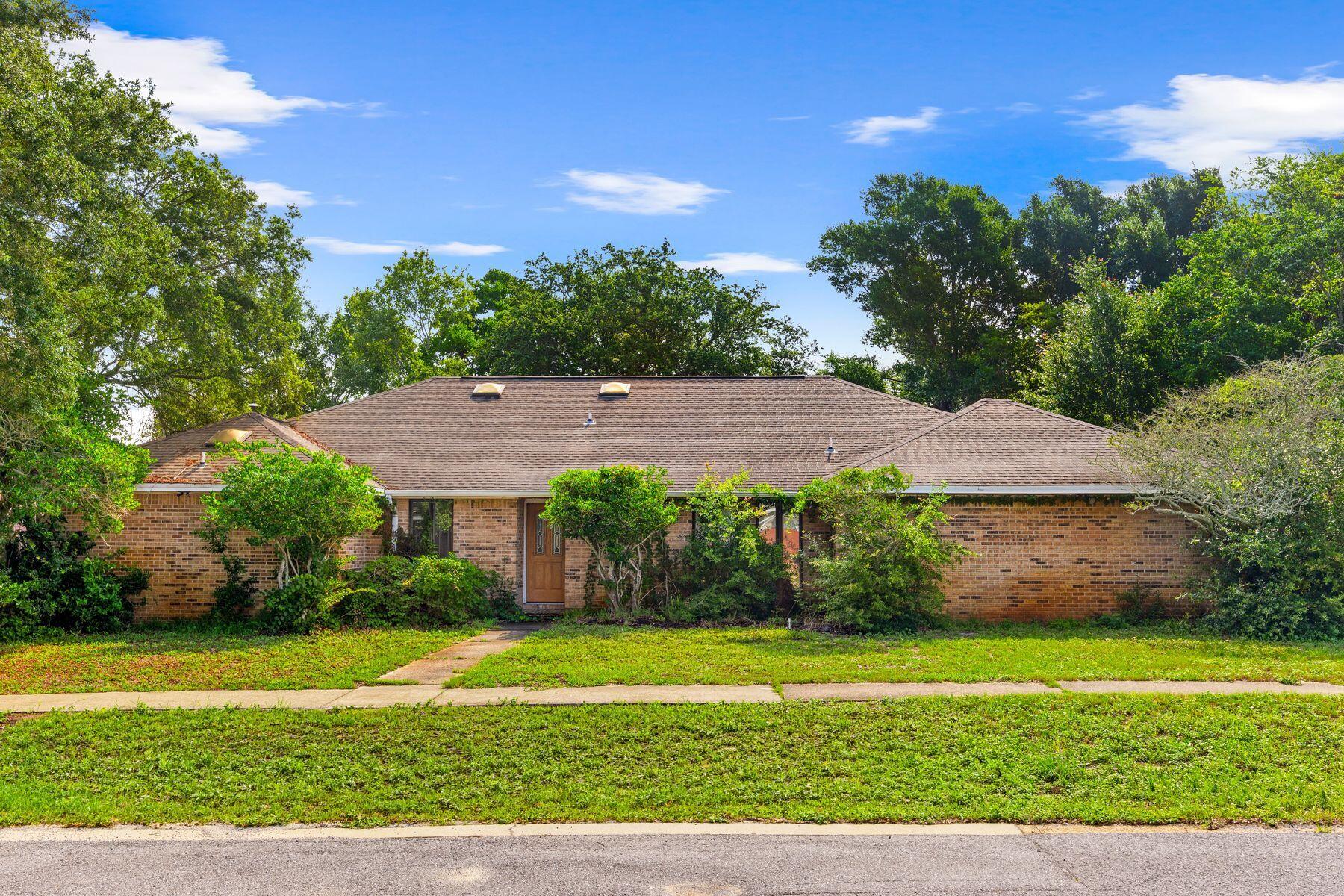 Cool off this summer in your private 25,000 gallon swimming pool complete with outdoor wetbar. Plenty of space for entertaining and secluded enough for backyard privacy. Backyard covered in gorgeous azaleas and shrubs. Pool is 6 feet deep and 2.5 feet deep in the shallow end. Home is currently being re-roofed and remodeled inside.