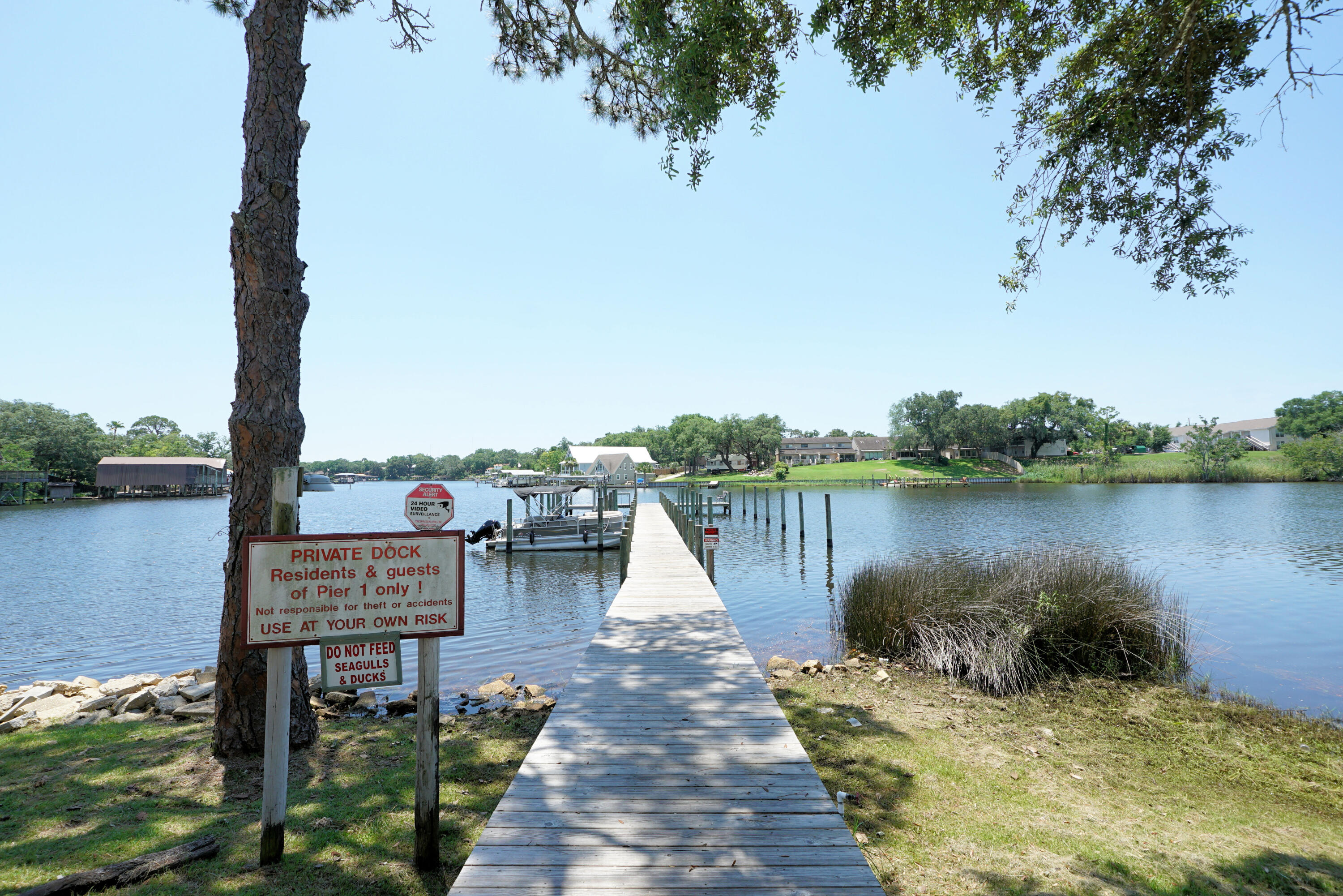 Enjoy elevated Cinco Bayou views from this move-in ready, second-floor 2-bed, 2-bath unit in Pier One's A Building. This property sits just minutes from Eglin AFB and Hurlburt Field. The unit offers a total electrical re-wire to current code completed in 2025, including hardwired ceiling fans, hardwired safety detectors, and new recessed lighting, alongside a brand-new multi-layer building roof installed in 2025. HVAC system and water heater are 2021.

The spacious 1,025 square foot floor plan boasts a large primary suite, a full second bathroom, and a private balcony to catch the evening bayou breeze. The interior features fresh neutral paint and new bathroom showerheads. The kitchen is equipped with appliances updated in 2023 including a glass top stove, stainless microwave, dish washer, and refrigerator, and features a garbage disposal and granite countertops.

Community amenities include a sparkling pool overlooking the bayou, tennis courts, and boat slip rentals available on a first-come, first-served basis. Please note that condo regulations do not allow short-term rentals. Schedule your private showing today!