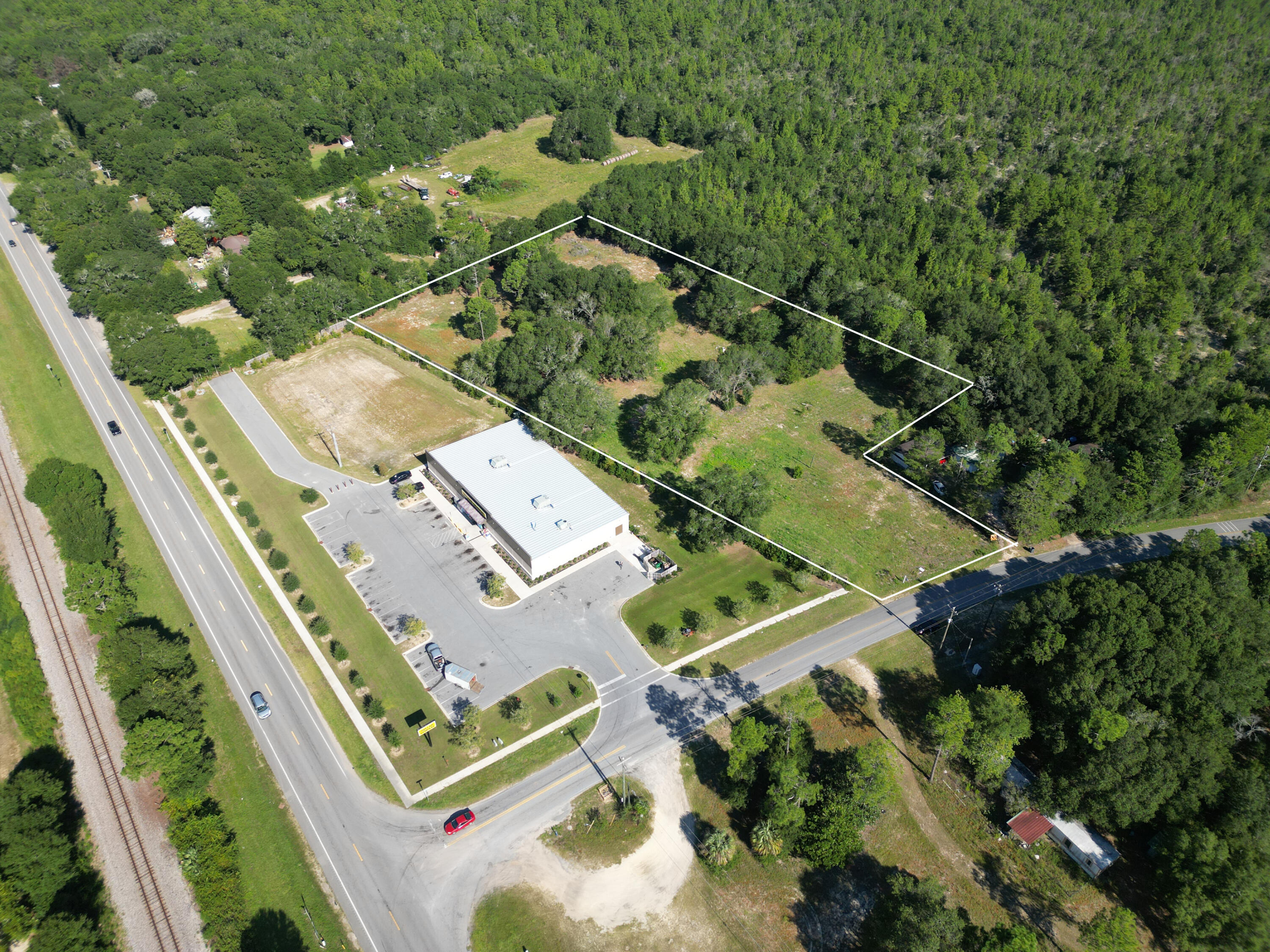 Positioned just off Highway 90 at Kings Lake Road, this 3.4-acre parcel offers exceptional visibility and accessibility in a growing area of DeFuniak Springs. Zoned General Commercial, the property is ideally suited for a wide variety of business ventures, from retail and service establishments to professional offices.
Located directly next door to Dollar General, the site benefits from strong traffic flow and established neighboring businesses, creating built-in visibility for future development. With its generous size, cleared land, and easy access to major thoroughfares, this property is ready for your vision.