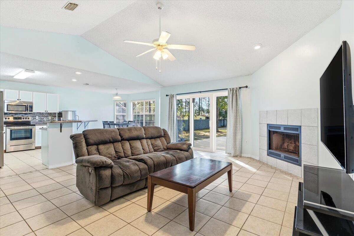 Holley by the Sea home in an X flood zone! Enjoy the privacy of a split bedroom plan, with an open kitchen, dining room, and living area adorned by a fireplace. Brand new sliding doors open up to the expansive, 20' x 22' patio which is perfect for hosting BBQ's or simply relaxing and gazing at your beautiful back yard complete with fruit trees. The coastal kitchen boasts a 2024 LG ThinQ refrigerator, stainless appliances and granite countertops. A 2025 Culligan drinking water filtration system which compliments the whole house water filtration and softener system. The gas water heater was replaced in 2024 complete with a kitchen line for future improvements. The primary bedroom has an ensuite with dual vanity, separate shower and soaking tub and large walk-in closet. Call to see today! Your laundry room includes the washer and dryer and is conveniently located between the primary bedroom and the garage. Just off the kitchen is the guest bathroom which is shared by two bedrooms. The roof was replaced in 2018. Oversized two car garage hosts the Culligan water filtration and softener system with plenty of room for your vehicles and lawn equipment. Your lovely yard is watered with a sprinkler system from a lawn pump. You will love the amenities in Holley by the Sea which include the Sound side recreational area plus and a boat launch off of Hwy399. This home won't last long, make your appointment to see it today!