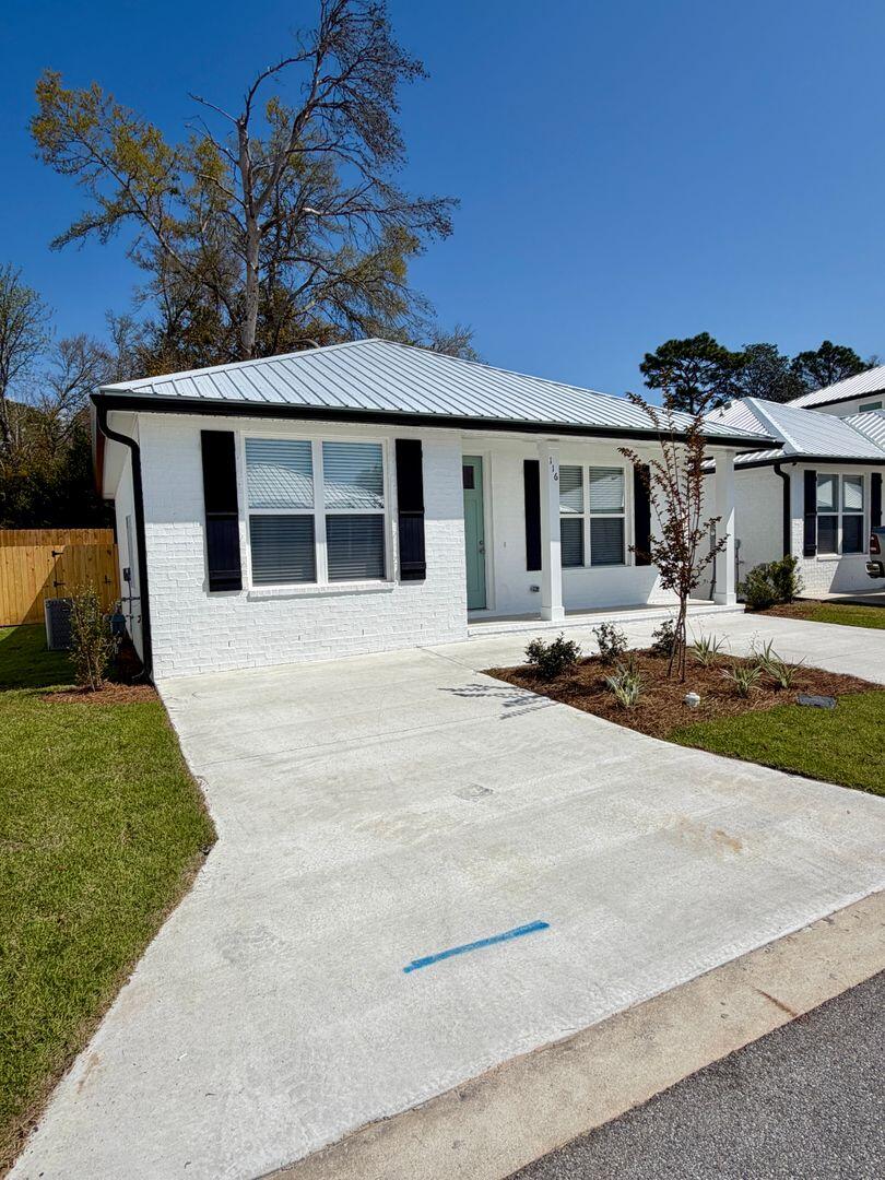 Welcome to The Cottages, a charming new neighborhood featuring just 20 homes within minutes to the gates of Eglin AFB. This new and beautifully crafted 2-bedroom, 2-bath cottage blends classic coastal style with modern comforts.  Painted brick accents, quartz countertops, stainless steel appliances, luxury vinyl plank and tile flooring, and a durable metal roof--all designed for low maintenance and long-lasting quality. The thoughtful layout offers bright, open living spaces and contemporary finishes throughout.  The home includes a 1 car garage with additional guest parking conveniently located within the neighborhood.  No smoking or vaping. NO cats, small dog may be allowed. Call 850-389-8787 for information.