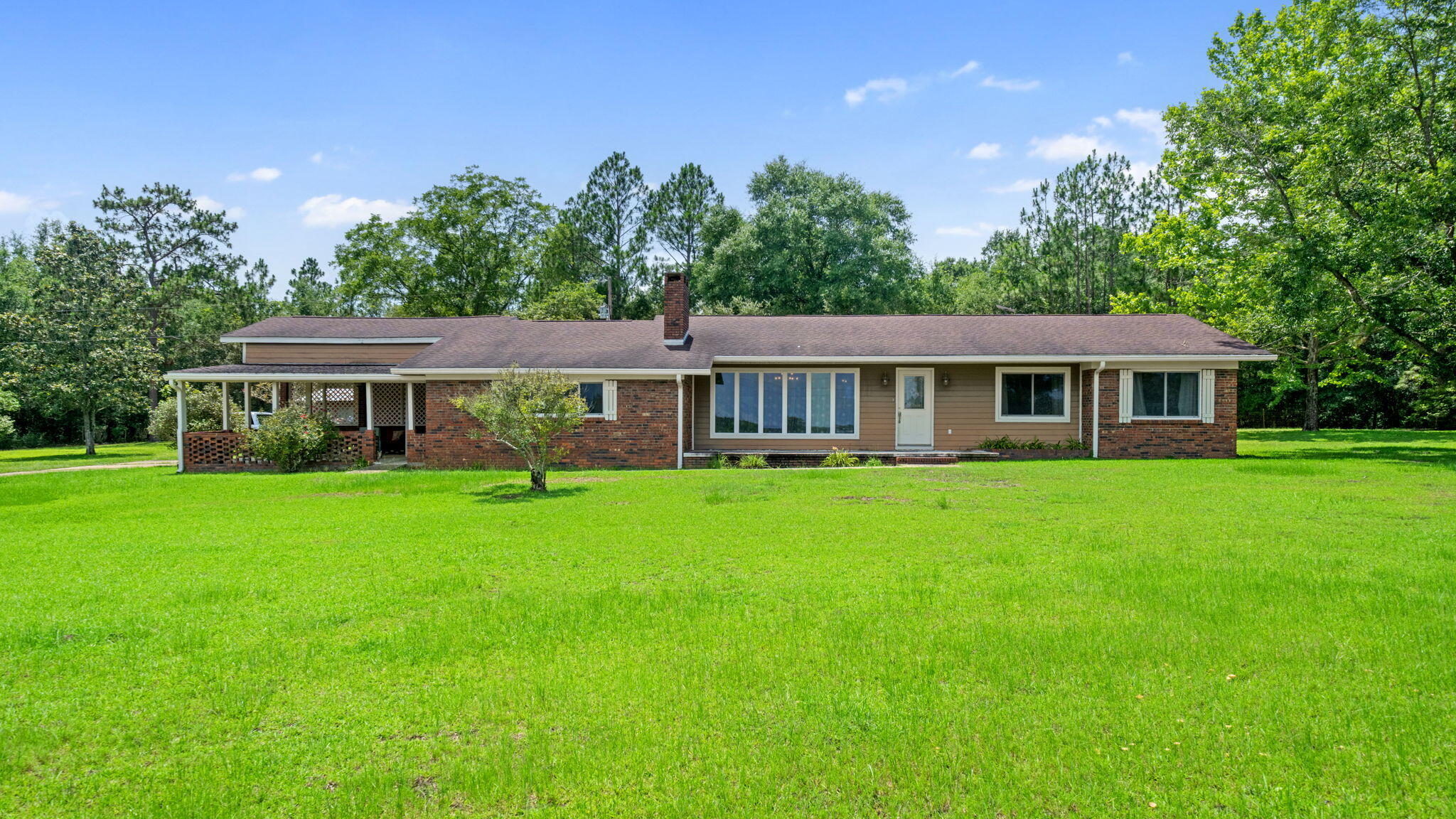 5 Acres | No HOA | No Deed Restrictions | Move-In Ready | Florida Panhandle

You didn't know you were looking for this...until right now.

There's a moment when you pull down that long driveway, cut the engine, and just... listen. No traffic. No neighbors. No HOA letter in the mailbox. Just five acres of yours, trees, sky, and the kind of quiet that reminds you why you wanted land in the first place.

That's what 1310 Carlis Lane feels like.

This isn't just a house in the Florida Panhandle. It's the place where you finally build the garden you've been pinning for three years. Where the kids chase fireflies after dinner. Where you can park the truck on the grass if you want to, because nobody's going to tell you otherwise.

And when you're ready to leave the property, the best of North Florida is right outside your door. Holmes Creek is a state-designated canoe trail with crystal-clear spring water, towering cypress trees, and some of the best bream and bass fishing in the Panhandle. The Choctawhatchee River, Florida's third largest river system, runs right through Holmes County, with boat ramps, paddling trails, and trophy largemouth bass waiting around every bend. Lake Victor, just minutes away, is a 130-acre fish management area loaded with bass, bream, and shellcracker. And when you want a saltwater fix, the Emerald Coast beaches are under two hours away. Ponce de Leon Springs and Morrison Springs are a short drive for swimming in 68-degree water on a hot summer day. Cypress Spring. Beckton Spring. Old growth hardwood swamps. This part of Florida is largely unexplored by the crowds and that's exactly the point.

The home sits on a full five private acres in Westville, tucked into Holmes County, where property taxes are low, the pace is slow, and the land still means something. Inside, you've got real living space, room to breathe, room to gather, room to make it yours. Step outside and the land opens up around you, tree-lined, private, and wide open with possibility.

The well and septic are already in place. The hard part's done. What you do with the rest is entirely up to you.

USDA and VA financing may be available, meaning this life might cost you less to start than you think. Westville puts you about 25 miles from DeFuniak Springs and under two hours from Pensacola and Panama City Beach, close enough to everything, far enough from all of it.

Some properties are just square footage. This one is a fresh start. 

Ready to come see it? Call or text to schedule your private showing today!