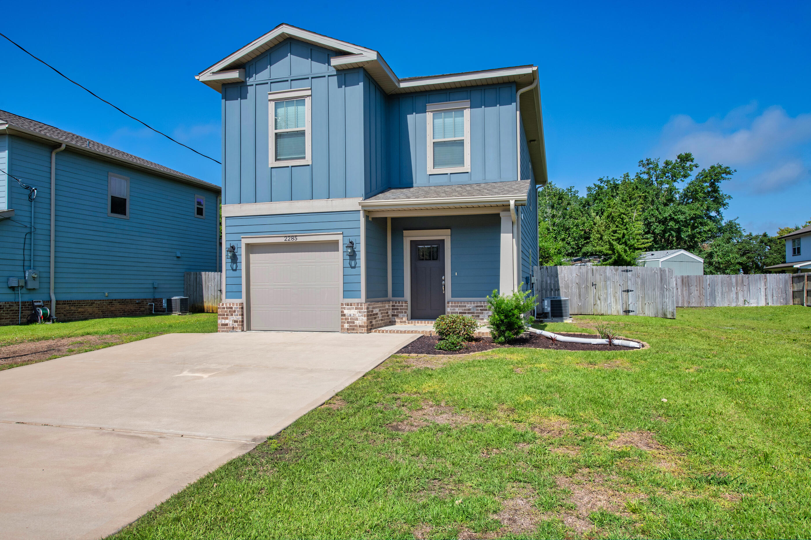 This well-maintained two-story home in East Navarre offers a great mix of comfort, style, & convenience. At just 3.5 years old, this 3-bedroom, 2.5-bath home is move-in ready & located only 5 miles from Navarre's beautiful white sand beaches, shopping, & restaurants, & is just 8 miles to Hurlburt Field AFB. Inside, you'll find an open & welcoming layout with luxury vinyl plank flooring throughout the main living areas & bedrooms, tile in the bathrooms & laundry room. Granite countertops & soft-close cabinets & drawers throughout the home give it a clean, modern feel, while details like transom doorways, ceiling fans in every bedroom & the living room, & a covered patio add extra comfort & character. The primary suite features a tray ceiling, oversized closet, & a spacious bathroom with double vanities & a tiled tub/shower combo. Whether you're looking for a primary home, beach-area getaway, or investment property, this East Navarre home is one you'll definitely want to see!