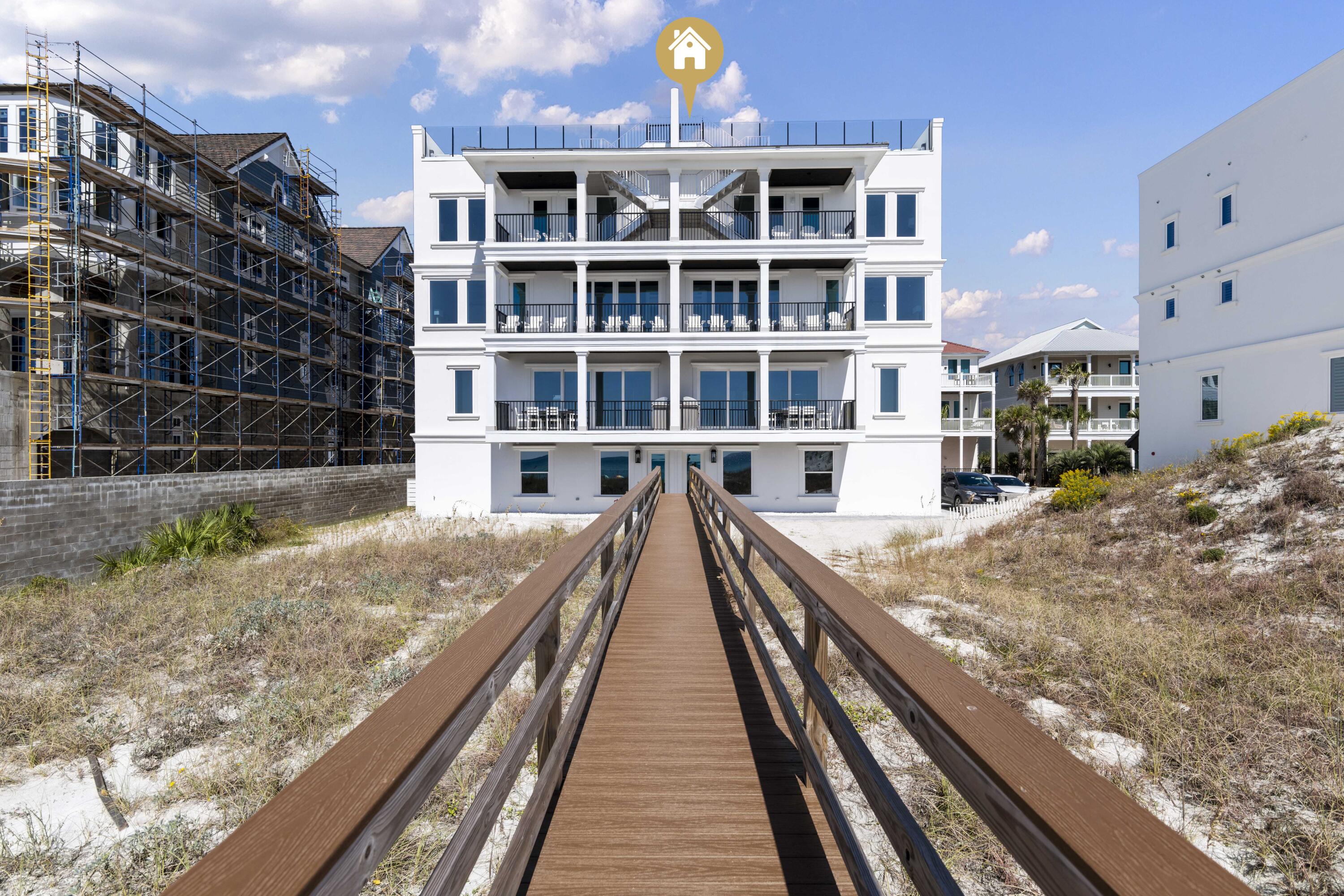 An exceptional Gulf-front residence that defines elevated coastal luxury, perfectly positioned along the pristine shores of 30A. Encompassing 4,216 sq ft with 4 Gulf-front bedrooms, this remarkable property sits on nearly an acre with 109 feet of direct Gulf frontage & private access via a shared dune walkover with Unit A. Designed to capture uninterrupted views of the emerald waters, the home offers multiple outdoor living spaces, including three Gulf-front balconies & a stunning rooftop terrace with a private pool overlooking the coastline. Thoughtfully designed by Eric Craig of B. Design, the residence showcases impeccable craftsmanship, clean architectural lines, and a seamless, flowing layout. Interiors are enhanced by soaring 9-10ft ceilings, wood-look porcelain tile, custom mosaic details, whitewashed spruce ceilings, and predominantly Kohler fixtures, all complemented by curated lighting and refined finishes throughout.

Engineered for both durability and efficiency, the home features ICF construction, impact-rated glass, superior insulation, four high-efficiency HVAC systems with built-in dehumidifiers, a tankless gas water system, central vacuum, security system, and full smart home integration for effortless remote control.

The main living level is designed for both relaxed living and elegant entertaining, featuring a Gulf-front great room with expansive windows, a covered balcony, and a chef's kitchen appointed with Sub-Zero refrigeration, a Wolf dual-fuel range with 8-burner gas cooktop, wine cooler, custom cabinetry, and designer backsplash. Architectural details such as coffered ceilings and tongue-and-groove accents further elevate the space.

Spanning four levels, the home offers multiple living areas and beautifully appointed bedroom suites, all Gulf-front, each designed to maximize views and privacy. The third level features two Gulf-front suites with balcony access and an additional living area, while the top-floor primary suite serves as a private retreat with sweeping Gulf views and a spa-inspired bath complete with a freestanding tub and walk-in shower. A first-floor game room with kitchenette and full bath provides a perfect transition from beach to home, ideal for entertaining.

The rooftop level is a true showpiece, featuring a private pool, expansive paver deck for sunning, and sleek glass railings that frame unobstructed panoramic Gulf views. An elevator services all four levels for added convenience, and the property includes a 1-car garage with additional parking in the drive.

Offered fully furnished and professionally designed, this turnkey residence presents an exceptional opportunity as a primary home, second residence, or a high-performing investment. With proven rental income of $282K in 2025, the property offers immediate revenue potential alongside long-term appreciation.

Ideally located in the heart of Seagrove Beach, this exclusive setting features a private, palm-lined street shared by only 3 other Gulf-front homes. Enjoy close proximity to Seaside, Alys Beach, and Rosemary Beach, along with local favorites such as Old Florida Fish House, Buddy's Seafood Market, Beachy Bean Coffee, and Coastside 30A. Outdoor enthusiasts will appreciate nearby Eastern Lake, one of the area's rare coastal dune lakes, as well as Deer Lake State Park, scenic nature trails, and the Timpoochee Trail for biking and exploration. A rare opportunity to own a truly distinctive Gulf-front property in one of 30A's most coveted locations.