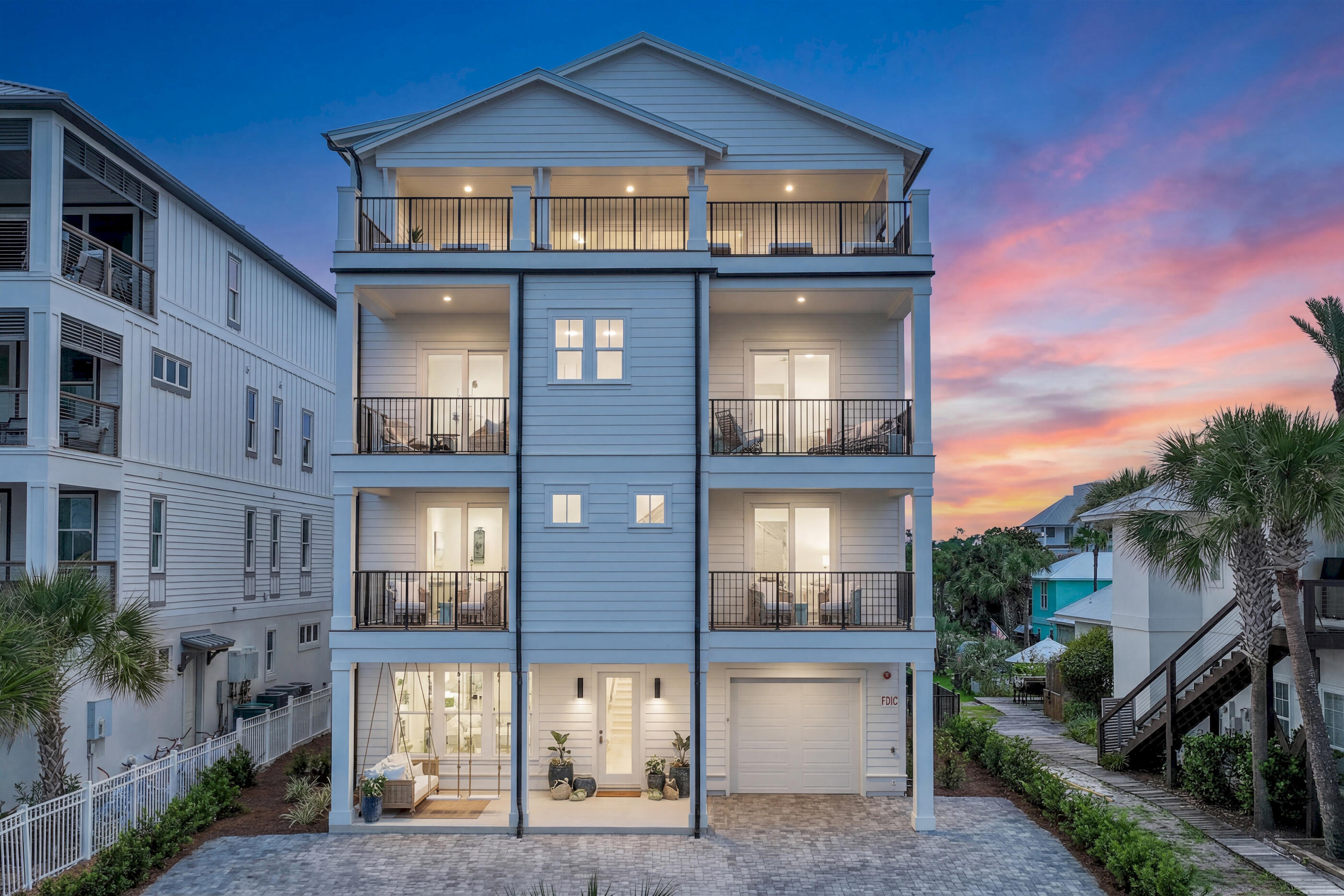 Just moments from the Gulf shoreline and positioned along one of Inlet Beach's most sought-after stretches, 58 Emerald Cove Lane presents a newly constructed coastal residence where architectural scale, thoughtful design, and effortless livability come together across four expansive levels. Offered fully furnished, the home encompasses 6,164 square feet with seven bedrooms, seven full bathrooms, and four half baths, creating a setting equally suited for elevated entertaining and relaxed coastal living. The property also offers the flexibility of short-term rentals permitted, adding versatility to its exceptional location and design.

Throughout the home, natural light and carefully framed Gulf views create a constant connection to the surrounding coastal landscape. Expansive oversized balconies extend the living spaces outward, offering inviting places for open-air dining, morning coffee, or evenings spent watching the sunset over the water.

The main living level is centered around a beautifully appointed kitchen designed to accommodate gatherings both large and intimate. A dramatic 14-foot island anchors the space, complemented by Thermador appliances, multiple dishwashers, and a built-in coffee maker that blend functionality with refined design. Just beyond, the open-concept living area is warmed by a striking six-foot Dimplex electric fireplace, adding atmosphere and architectural presence. The extraordinary primary suite is a private sanctuary designed for the ultimate in luxury and comfort. Thoughtfully appointed, it features a spacious sitting area and office perfect for relaxing while taking in breathtaking Gulf views. Dual spa-inspired bathrooms provide exceptional privacy and convenience, each beautifully designed with premium finishes and elegant details. Expansive walk-in closets offer abundant storage and custom organization, completing this remarkable retreat. Floor-to-ceiling windows frame sweeping panoramic views of the Gulf, creating a serene backdrop that transforms every morning and sunset into an unforgettable experience.