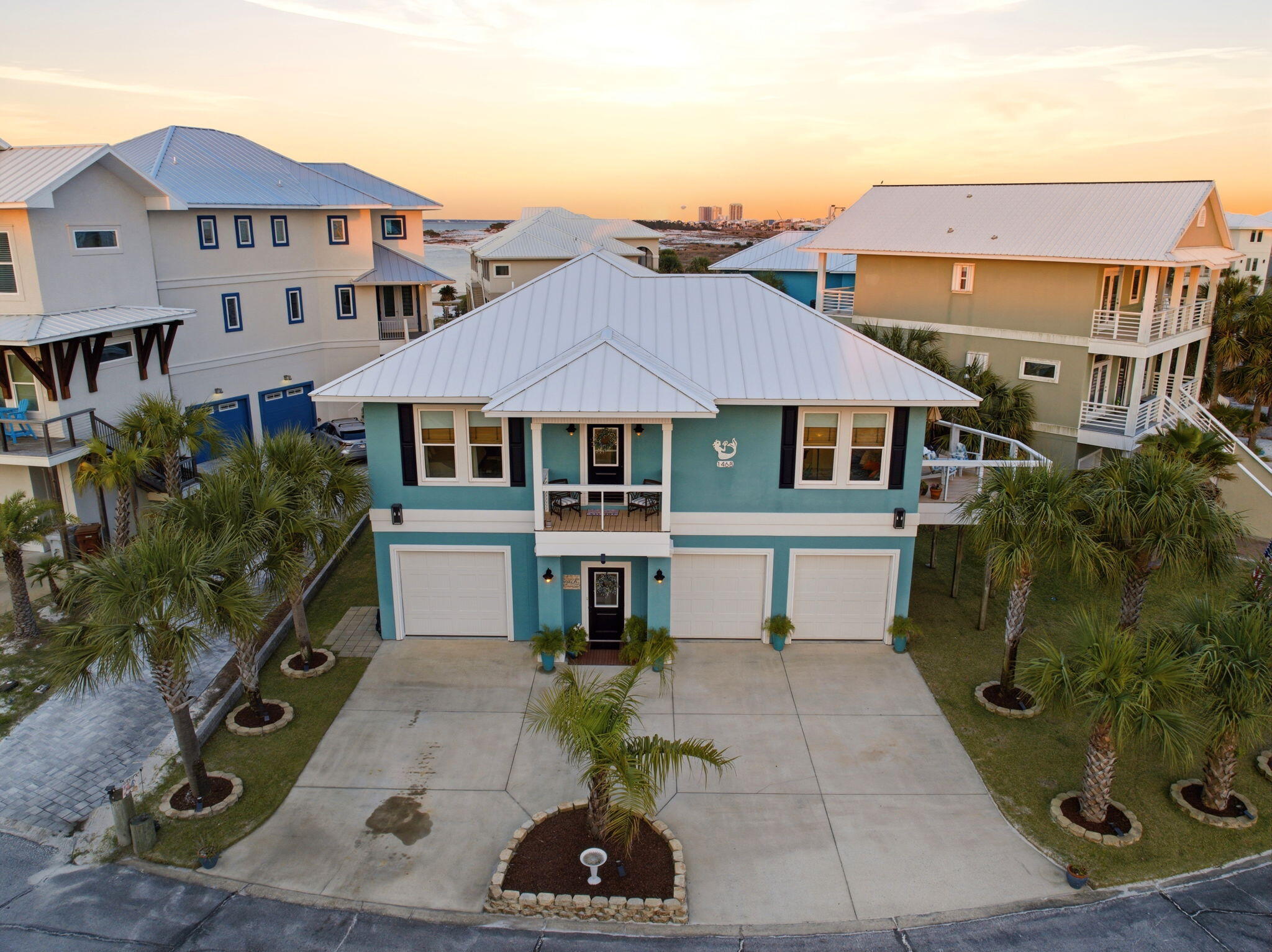 Welcome to Your Private Coastal Sanctuary in Caribbean Isle on Navarre Beach

From the moment you enter the exclusive, gated community of Caribbean Isle, you're transported into a true tropical paradise--complete with winding roads, vibrant coastal architecture, underground utilities, streetlights, and resort-style amenities including a community pool and tennis courts.

Perfectly positioned in one of the most desirable locations within the neighborhood, this custom-built, one-owner beach home offers the ultimate blend of privacy, convenience, and luxury. Just steps from your back door, you'll find direct access to the sugar-white sands and emerald waters of the beach. Enjoy peaceful morning strolls along the quiet shoreline, or head just across the street to experience the energy of Gulf. Designed for Coastal Living & Entertaining

This thoughtfully designed residence features four spacious sleeping areas, including a custom bunk room with built-in beds and storage--perfect for hosting family and guests. Every inch of this home reflects intentional design and elevated coastal style.

The main living spaces are pouring with natural light, enhanced by expansive windows and three generous porches that capture both sunrise and sunset views. With water views from nearly every angle, the connection to the coast is felt throughout the home.

The chef's kitchen is a true showpiece, featuring ceiling-height light blue cabinetry, upgraded countertops, designer sconce lighting, and an open layout ideal for entertaining.

Exceptional Features Inside & Out

Impact-rated glass for enhanced durability and lower insurance costs

Luxury vinyl plank flooring with a soft driftwood finish

Custom cable railing on decks for unobstructed water views

Metal roof for long-term durability

Deep soaking tub and designer tile shower in the primary suite

Abundant storage throughout, including a space designed for a future elevator (plans available upon request)

Ground Level Coastal Retreat

The lower level offers an incredible flex space--ideal for a den, game room, or "man cave"--featuring a unique glass garage door that allows natural light to pour in while maintaining privacy. Just outside, a private outdoor shower provides the perfect spot to rinse off after a day at the beach. (This was not added into the upstairs square footage.) 

With over 1,600 square feet of garage space, there's ample room for multiple vehicles, golf carts, and all your beach and boating gear.

Outdoor Living at Its Finest

The professionally enhanced landscaping, complete with multiple palm trees, perfectly frames the home and enhances its tropical curb appeal. Every outdoor space invites relaxation, from breezy porches to shaded areas below.

Additional Highlights

Located in the gated community of Caribbean Isle

Low HOA: $485/quarter

Flood Insurance: ~$996/year

Homeowners Insurance: ~$3,700/year

Furniture negotiable with acceptable offer

This meticulously maintained home offers not just a residence, but a lifestyle--where every day feels like a vacation.

Experience the beauty, comfort, and luxury of Navarre Beach living in Caribbean Isle. Schedule your private showing today. The community has an annual Road Reserve of $300.00 in addition to annual HOA dues. Buyer to verify all information deemed important to buyer including but not limited to lot size, room measurements, etc. prior to closing
