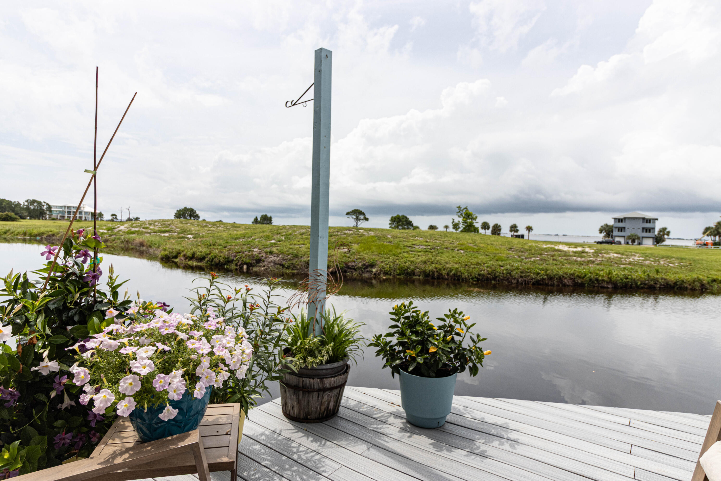 Enjoy beautiful views of the Santa Rosa Sound from your private deck and balcony in this updated 2-bedroom, 2.5-bath townhome in the sought-after Lionsgate community, just minutes from Tiger Point Golf Course.

The updated kitchen features butcher block countertops, stainless steel appliances, a porcelain farmhouse sink, soft-close shaker-style cabinets with a Lazy Susan, subway tile backsplash, and tile flooring. The open living area offers a gas fireplace, wet bar, and sliding glass doors leading to a newly installed Flex Deck overlooking the community pond. Relax outdoors while enjoying the peaceful setting and watching fish and turtles below. An exterior storage closet provides additional space for beach gear and outdoor equipment.

Upstairs, the split-bedroom floor plan offers added privacy, with both bedrooms featuring private en-suite baths and newly installed luxury vinyl plank flooring. The landing provides the perfect space for a small flex area or reading nook. The primary suite includes a private balcony with views of the Sound, while the en-suite bath features a soaking tub with water views, a separate glass-enclosed shower, dual vanities, and two walk-in closets.

Experience the relaxed coastal lifestyle you've been searching for in this exceptional home.