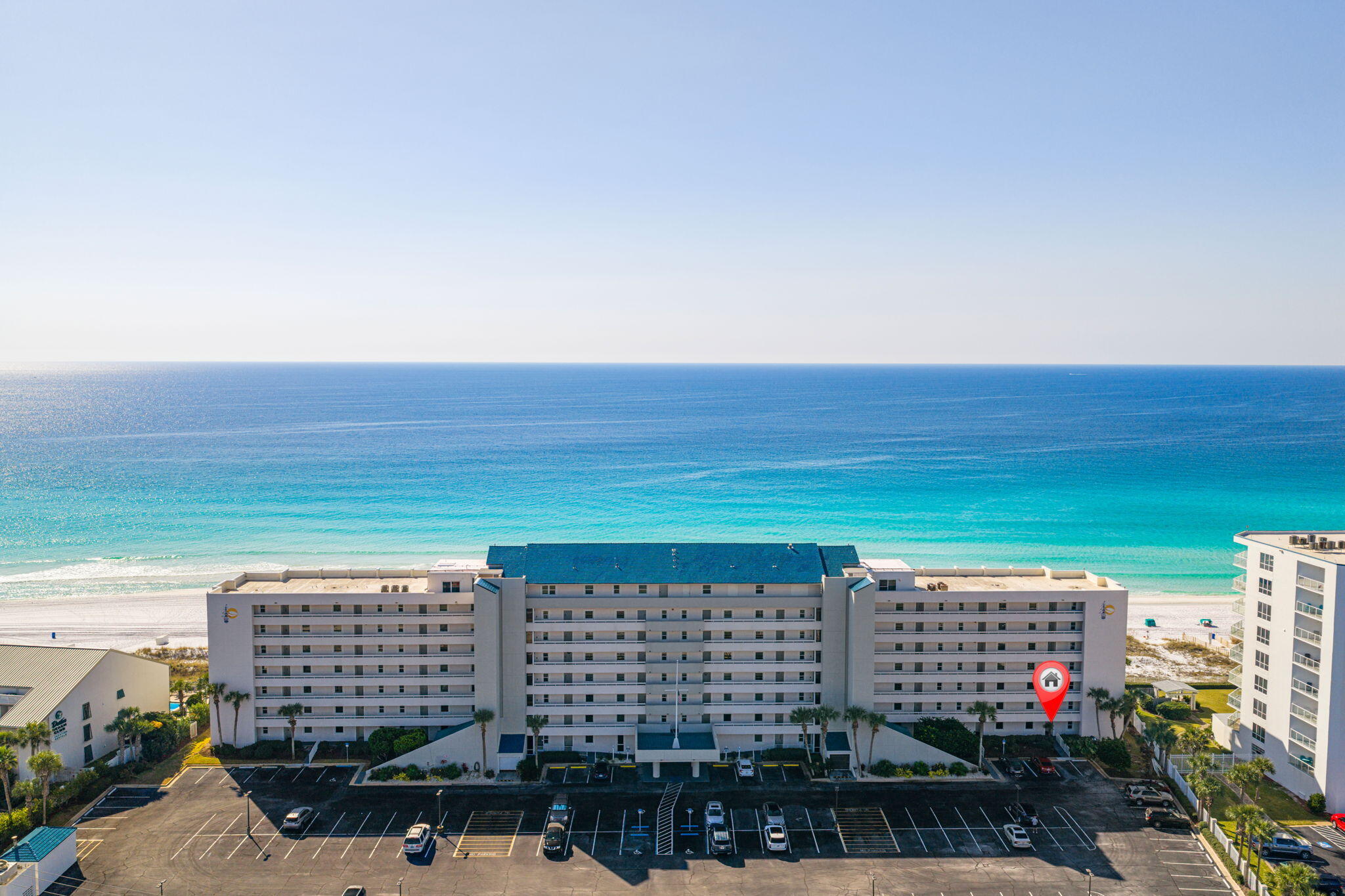 5.875% Low Interest Rate Available for Financing!! Experience true Gulf-front living from this highly sought-after first-floor residence at the exclusive Grand Mariner in Destin. Enjoy breathtaking, unobstructed views of the emerald-green waters and sugar-white quartz sandy beaches from your deep covered patio—just steps from the pool, lush landscaping, and the private 375-foot deeded beach. This is a must-see property -- this million-dollar value truly needs to be experienced in person to really appreciate everything it has to offer. From the moment you enter, the panoramic Gulf views take center stage. This single-level condo offers the ultimate in convenience with front-door parking and no stairs or elevators to navigate. Your patio doors open directly to paradise—perfect for morning coffee, sunset cocktails, or effortless beach access.

Inside, the spacious open-concept kitchen, dining, and family room are designed for coastal living and entertaining. The Gulf-facing primary suite offers incredible views and a private ensuite bath. A generous guest bedroom and second full bath provide ample space for family or guests. Exterior storage is included for all your beach gear.  Offered fully furnished and turn-key, this lovingly maintained second home has been cherished by one family for years. Furnishings include a bronze dolphins glass top coffee table and original artwork.  Short-term rentals are not permitted, preserving the tranquility of this private, owner-exclusive community.


Location is unbeatable -- minutes to the private Destin Airport, Indian Bayou Country Club, and the Destin Harbor for fishing, boating, dining, and entertainment. Enjoy nearby world-class golf at Indian Bayou, Kelly Plantation, and Regatta Bay, or walk to some of Destin's best restaurants and family attractions.  Resort living at its finest -- Grand Mariner offers a Gulf-front pool, fitness center, gated entry, and pristine beachfront grounds. Facing due south, this rare ground-floor unit provides effortless access, captivating views, and coastal luxury in one perfect package.