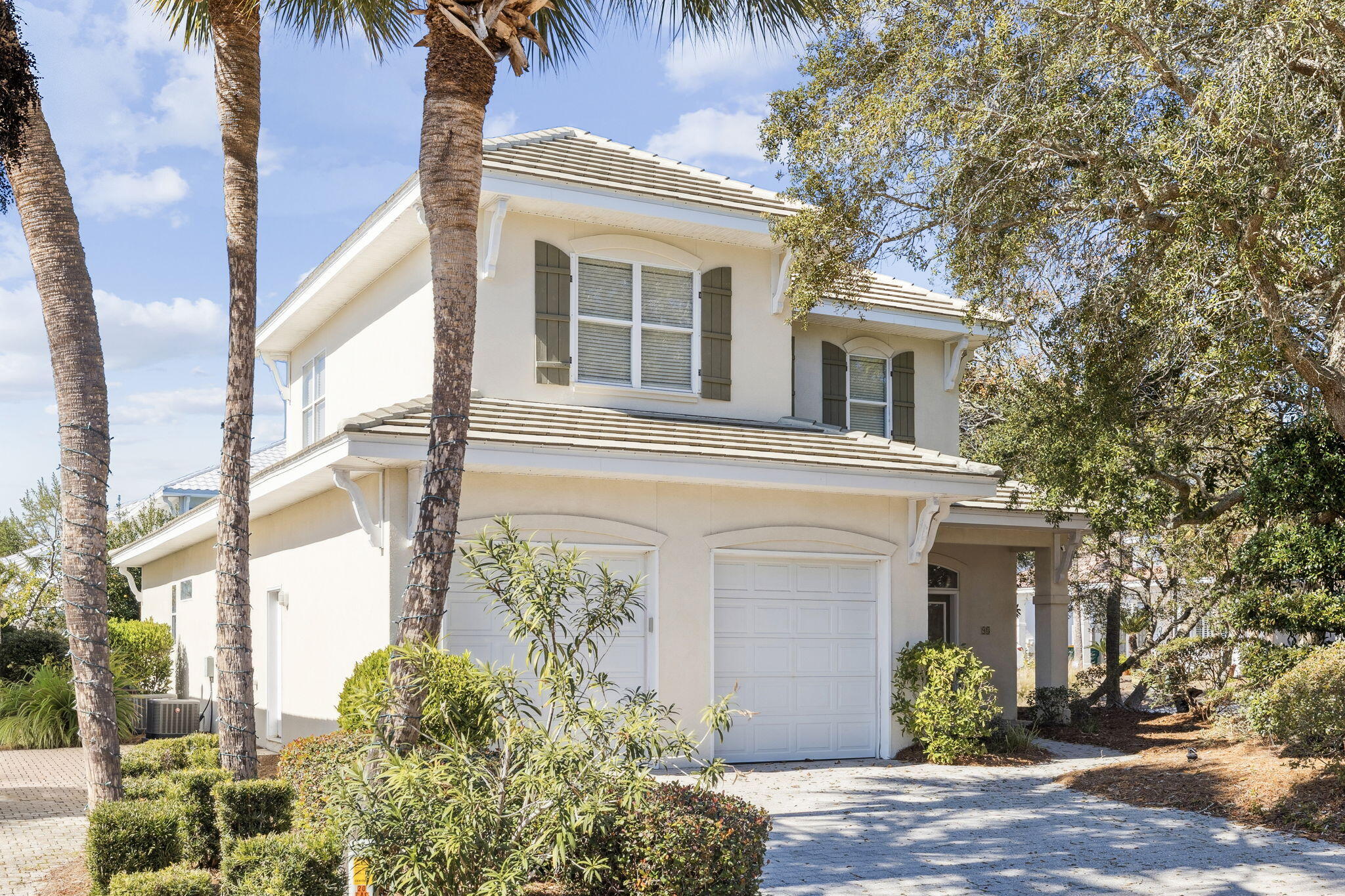 98 Cayman Cove is minutes from the stunning Destin Beaches, this exceptional home is located in the highly sought-after gated beach community of Destiny. Step inside to experience a gorgeous open-concept floor plan with soaring ceilings that create a bright, airy atmosphere throughout. Enjoy a cozy sitting nook, perfect for relaxing while taking in views of the lush, beautifully maintained outdoors. The master suite offers a luxurious spa-inspired bath, featuring a double soaking tub and spacious walk-in shower, the perfect retreat for unwinding at the end of the day. Situated on a large corner lot surrounded by manicured trees and landscaping, providing privacy and a serene sense of space. The massive two-car garage includes built-in storage, adding both function and utility. Meticulously maintained and truly one of a kind, this home embodies beachside luxury at its finest.
Come see it for yourself - your coastal dream home awaits!