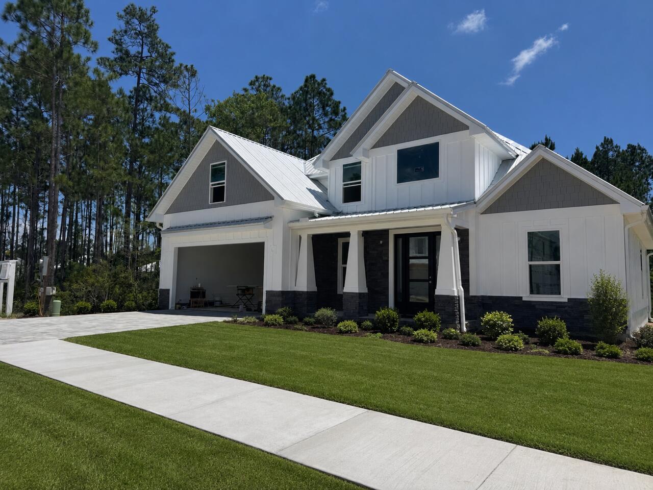 New construction in Bear Creek by Andrews Properties, distinguished by high quality construction, durable premium materials, and upgraded finishes. This 4-bedroom, 3.5-bath two-story home includes an office, 2-car garage, open living/kitchen/dining layout, upstairs TV/flex space, wood cabinetry, quartz countertops, wet bar, butler's pantry, multiple walk-in closets with wood shelving, and all appliances included. Construction and exterior upgrades include a 26-gauge metal roof, Hardie siding, paver driveway and walkways, covered front porch and screened rear porch. A strong option for buyers comparing build quality, materials, and long-term value in Bear Creek. Amenities include resort-style pool, fitness center, tennis, and pickleball. Buyer must confirm all measurements
