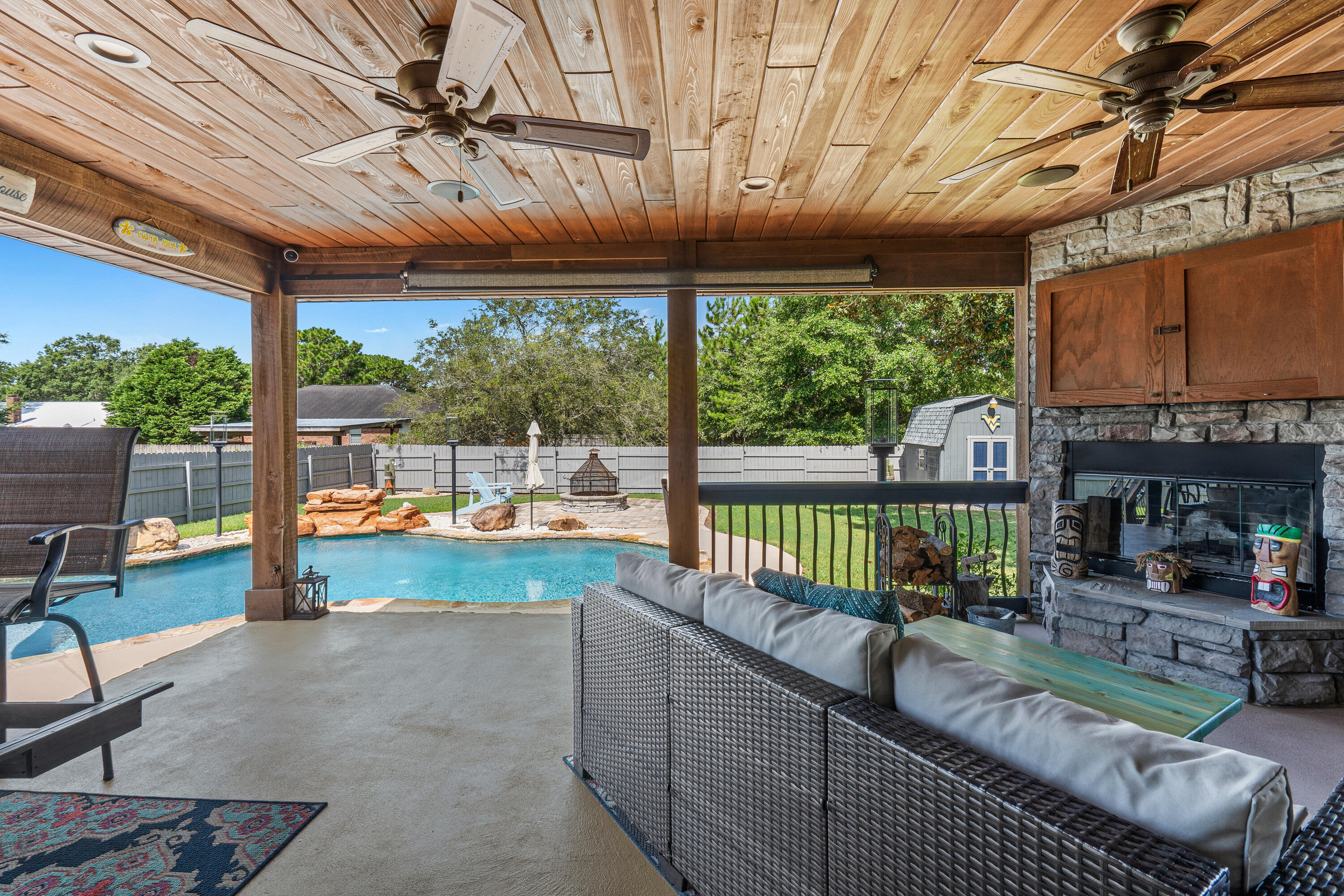 Welcome to your own private oasis in the heart of Navarre! This beautifully maintained 3BR/2BA home offers 1,649 SF of thoughtfully designed living space and an incredible backyard built for entertaining. Enjoy a heated Gunite pool with waterfall, stamped concrete patio, fire pit, covered porch, and a stunning wood-burning stone fireplace perfect for year-round gatherings. Inside you'll find an open floor plan, spacious living area, granite countertops, stainless steel appliances, abundant natural light, and a split-bedroom layout for added privacy. The fully fenced backyard provides plenty of room to relax or play, while the oversized driveway and 2-car garage offer ample parking. Conveniently located just minutes from Navarre Beach, Hurlburt Field, shopping, dining, schools, and more. Whether you're searching for your forever home, a vacation retreat, or the ultimate entertaining space, this property checks all the boxes. Schedule your private showing today!