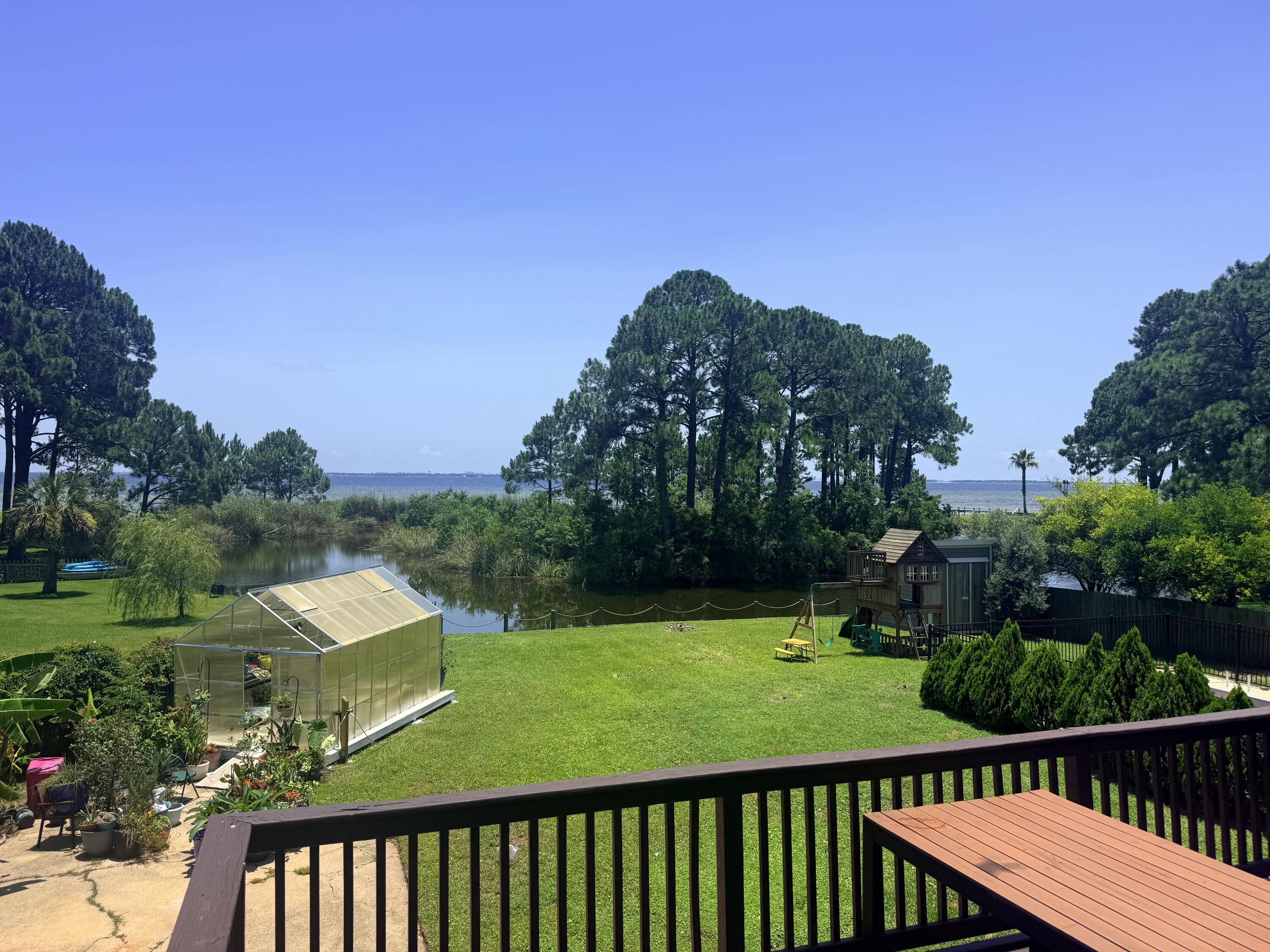 Photos done 7/1!
Showings start 7/3!
Open House 7/5!

PAID OFF SOLAR PANELS! Seller willing to pay for $13k quoted pool liner repair with an acceptable offer.
Roof and HVAC- 2-3 years old
Upstairs- Brand new tankless W/H 

This beautiful Lake Lorraine home offers you with amazing panoramic views of the Choctawhatchee Bay. Wake up to the natural scenes that are complete with wildlife in the lagoon and boats passing by in the bay. Charm and character are visible throughout this multi level home. Ideal for a large family and perfect for entertaining. The sunken living area is partnered with glass doors providing the incredible view but also tons of natural light. Upstairs offers a master and full bath, a bedroom with a full bath, 1/2 bath and the laundry room with a closet (Can be turned into a bedroom), dining area and kitchen.  Lower level has 1 master bedroom with full bath, additional bedroom, another full bathroom and two half bathrooms With 4 additional rooms (no closets but room to add), Two sets of washer/dryer hookups downstairs and one upstairs, and a bath accessible from outside making it the perfect pool bathroom. 

Exterior.. Seller's planted pear, apple and mulberry tree (front) and Banana, Olive and pineapple guava trees (Back). In ground pool, fenced in for safety, outdoor shower, a dock to fish from or launch your paddle board, RV parking that includes electrical and sewer, solar panels (Paid Off) which gifts you with only about a $40 power bill. Don't miss it!