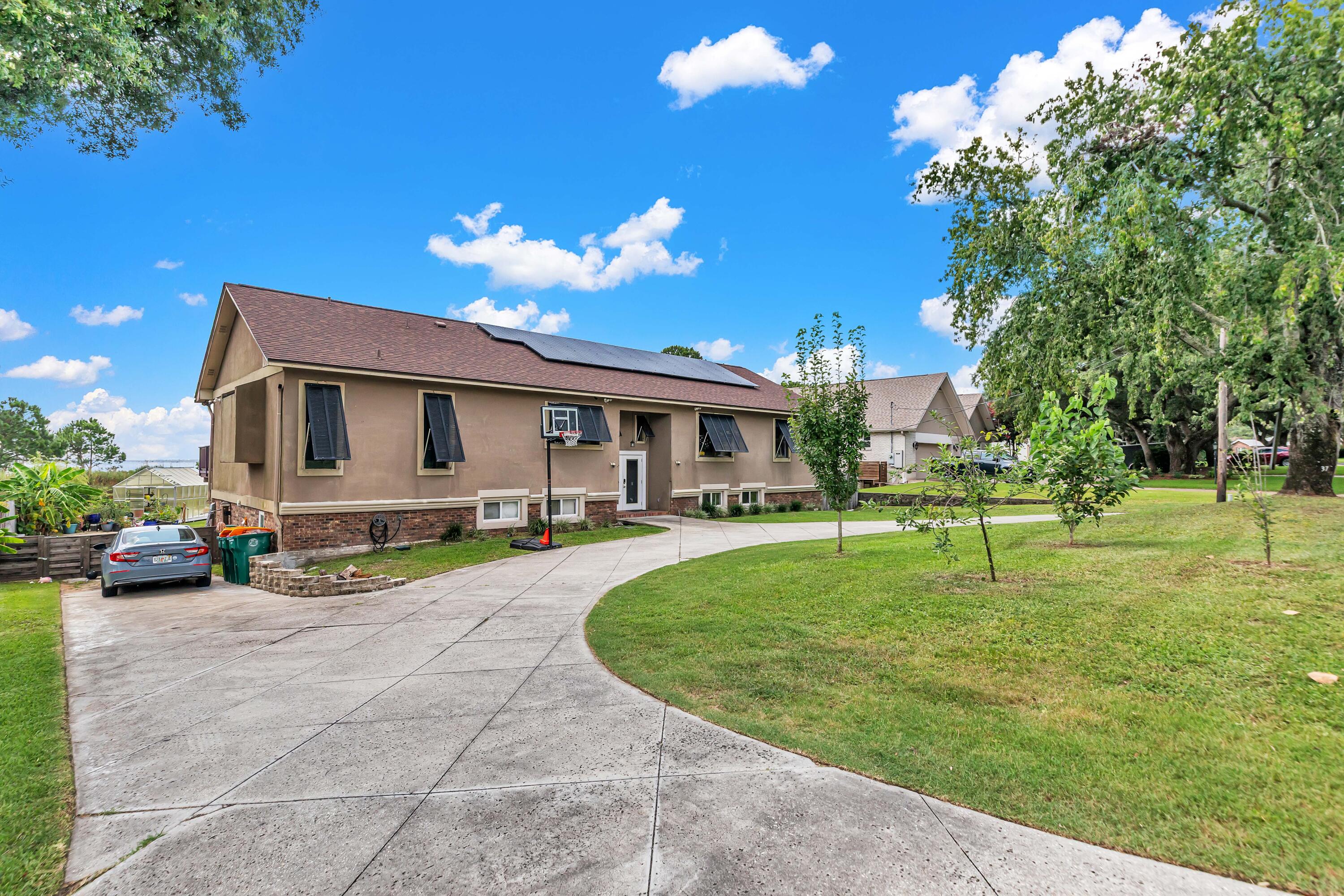 Photos done 7/1!
Showings start 7/3!
Open House 7/5!

PAID OFF SOLAR PANELS! Seller willing to pay for $13k quoted pool liner repair with an acceptable offer.
Roof and HVAC- 2-3 years old
Upstairs- Brand new tankless W/H 

This beautiful Lake Lorraine home offers you with amazing panoramic views of the Choctawhatchee Bay. Wake up to the natural scenes that are complete with wildlife in the lagoon and boats passing by in the bay. Charm and character are visible throughout this multi level home. Ideal for a large family and perfect for entertaining. The sunken living area is partnered with glass doors providing the incredible view but also tons of natural light. Upstairs offers a master and full bath, a bedroom with a full bath, 1/2 bath and the laundry room with a closet (Can be turned into a bedroom), dining area and kitchen.  Lower level has 1 master bedroom with full bath, additional bedroom, another full bathroom and two half bathrooms With 4 additional rooms (no closets but room to add), Two sets of washer/dryer hookups downstairs and one upstairs, and a bath accessible from outside making it the perfect pool bathroom. 

Exterior.. Seller's planted pear, apple and mulberry tree (front) and Banana, Olive and pineapple guava trees (Back). In ground pool, fenced in for safety, RV parking that includes electrical and sewer, solar panels (Paid Off) which gifts you with only about a $40 power bill. Don't miss it!