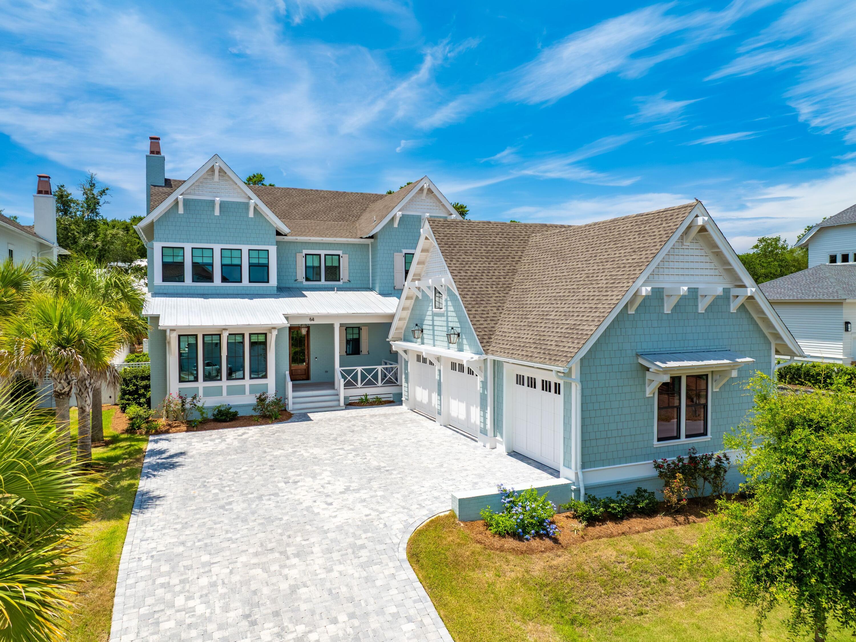 Experience the epitome of coastal living at this exquisite residence, harmoniously blending privacy, convenience, and coastal elegance. The property spans 4,075 square feet and features four bedrooms, four full bathrooms, 2 powder baths, a private pool and spa, and a three-car garage.
Nestled along a secluded street, this impeccably designed oasis offers serene tranquility just steps from 30A and the beach. A brand new golf cart valued at $20,000 is included in the sale, simplifying the turnkey experience.
Upon entering, you will be greeted by an elevated interior adorned with Venetian plaster, designer wallpaper, mitered and coffered ceilings, white oak hardwood floors, and beautifully tiled bathrooms throughout. The first level seamlessly transitions from an open concept living and dining area to a chef's kitchen equipped with a spacious center island, quartz countertops, mosaic tile backsplash, Wolf & Sub-Zero appliances, and extensive custom cabinetry.
The screened outdoor porch, complete with a summer kitchen and fireplace, provides an ideal setting for relaxation. An outdoor sanctuary includes the heated pool, spa, sun shelf and a dedicated bathroom. A junior primary suite is located on the main level, featuring a spacious ensuite bathroom. A custom laundry and sandroom, complete with built-in bench, lockers, and cabinets, ensures the organization of beach gear. Ascending to the second floor via elevator or custom staircase, you will discover the grand primary suite boasting raised ceilings, a retreat spa bath, walk-in custom closet and a private balcony overlooking the backyard. A secondary living/flex space, two guest bedrooms with ensuite bathrooms and laundry complete the upper floor. 
Additional upgrades include a Halo Air Purifier system, epoxy-finished garage floors and designer lighting throughout, enhancing the residence's impeccable appearance.