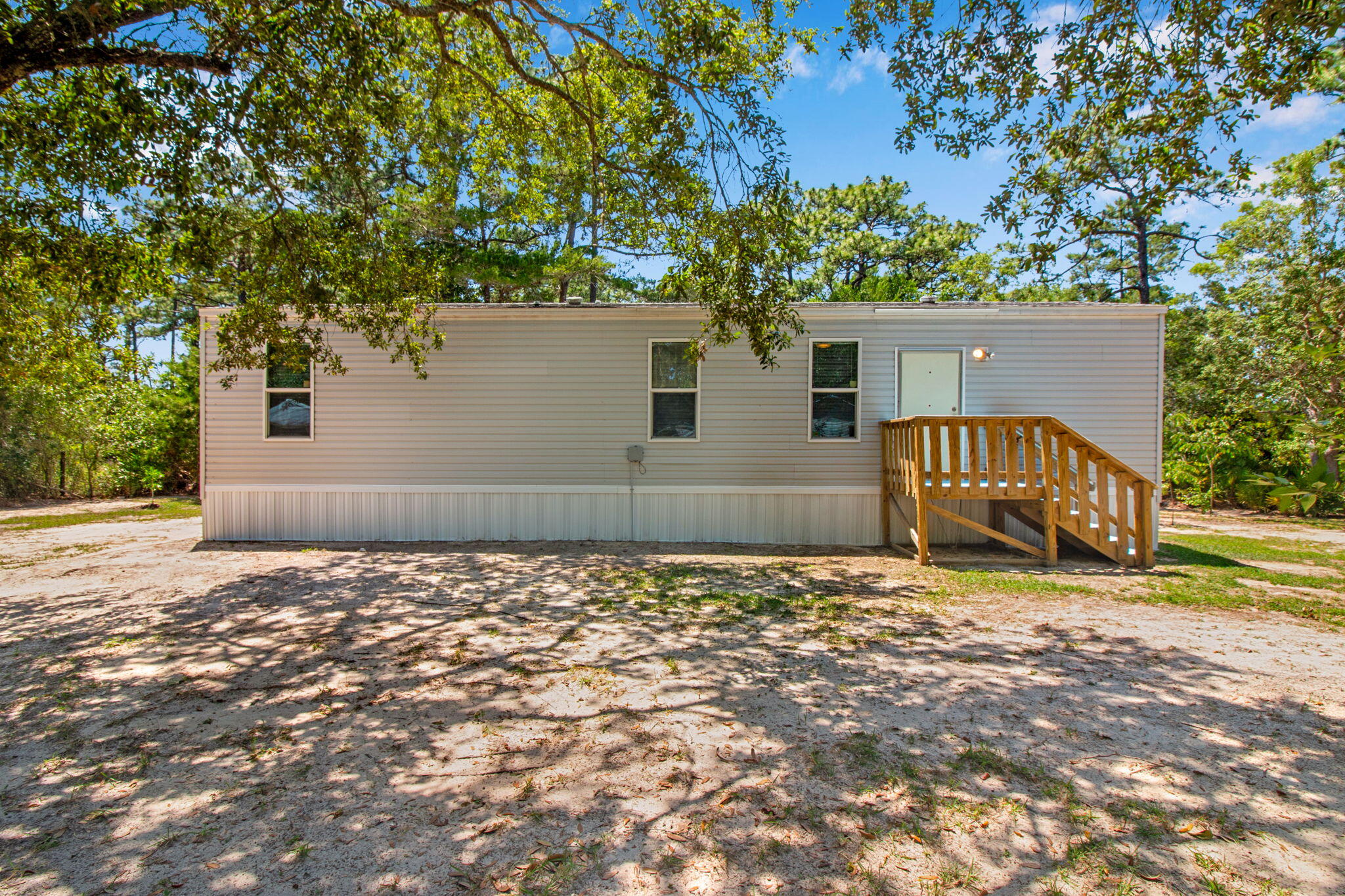Located in Peachtree Farm, this well-maintained 2BD/1BA manufactured home offers the opportunity to enjoy the Emerald Coast lifestyle. Conveniently situated near local shopping, dining, entertainment, and the world-famous white sand beaches of 30A and the Gulf Coast, the property combines comfort, convenience, and value in one of Northwest Floridas most sought-after coastal communities. Nearby listings in Peachtree Farms highlight the areas proximity to beaches, boat ramps, schools, and retail centers.

The home features an open layout with easy-to-maintain flooring throughout and no carpet, creating a clean and low-maintenance living environment. Included washer and dryer appliances add everyday convenience, while the additional storage unit provides extra space for tools, beach gear, or seasonal items.

Tenant pays all utilities. Holding fee is due within 24hrs of approval. Lease must start within 14 days of payment. Lease Prep Fee of $75 is due prior to move in. Approved pets require $400 pet fee per pet. Renters insurance is required. Property is available for a 12-month lease.