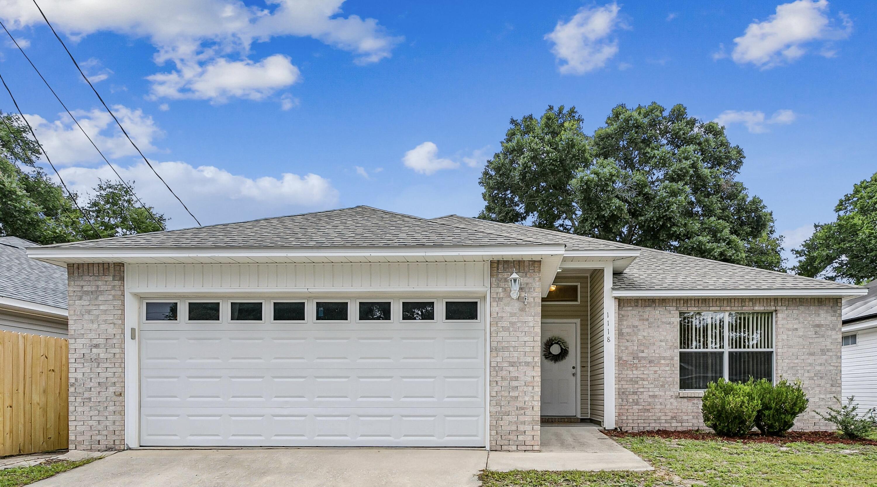 Welcome home to this charming 3-bedroom, 2-bathroom residence offering 1,450 square feet of comfortable living space in the heart of Niceville. Featuring an open-concept floor plan with vaulted ceilings, this home is light and bright, spacious, and inviting from the moment you enter. The large living and dining areas flow seamlessly into the kitchen, creating the perfect space for entertaining family and friends. The kitchen offers tons of cabinet and countertop space, a huge breakfast bar for casual dining, and a functional layout that opens to the main living areas. The primary bedroom and on suite bathroom offers a very spacious design with a walk in closet. Two additional bedrooms offer flexibility for guests, a home office, or growing families with lots of storage. Beautiful LVP flooring throughout home adds both style and easy maintenance.
Step outside to enjoy the covered back patio and fully fenced backyard, ideal for relaxing, grilling, or letting pets play. The two-car garage provides additional storage with attic space.
Conveniently located near top-rated Niceville schools, shopping, dining, parks, military bases, and the beautiful Emerald Coast beaches, this move-in ready home combines comfort, functionality, and an unbeatable location. Welcome Home!!