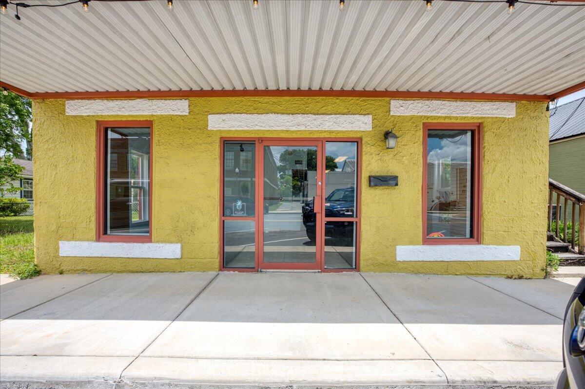 Effective Year Built 1998! 
Beautifully renovated commercial building located in the heart of Historic Downtown Crestview. Positioned within easy walking distance to local shops, restaurants, the courthouse, county offices including the tax collector and supervisor of elections, Crestview City Hall, and directly across from the Pharmacy College, this property offers exceptional visibility and convenience in one of Crestview's most active downtown corridors.

The downstairs unit features an open and airy layout ideal for retail, boutique, showroom, or customer-facing business use. The space includes two bathrooms and a convenient kitchenette, creating a functional and welcoming environment for clients and staff alike.

Upstairs, you'll find a charming office suite full of character with original hardwood floors and ceilings that showcase the building's historic appeal. The upper level offers a well-designed layout featuring a conference room, two private offices, two bathrooms, and a full kitchen -- making it an excellent setup for professional offices, consulting firms, creative studios, or mixed-use possibilities. With its prime downtown location, historic charm, and flexible layout, this property presents an outstanding opportunity for investors or business owners seeking a move-in-ready commercial space in the center of Crestview.