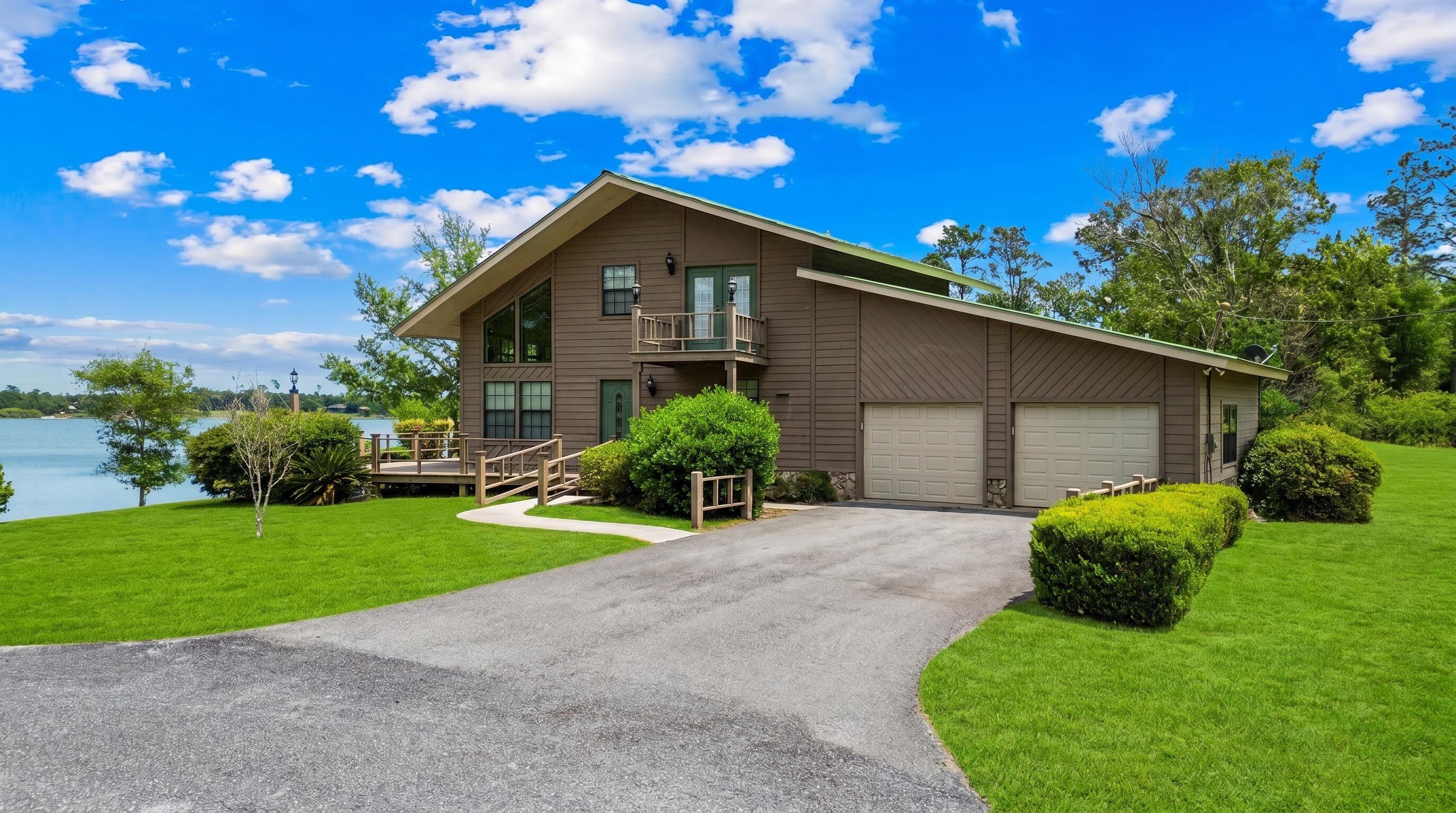 Discover the ultimate waterfront retreat at 84 S Silver Lake, a rare gem nestled on over 2 sprawling acres in the heart of Jackson County, Florida. This isn't just a home; it's a private sanctuary designed to celebrate its unique natural surroundings. Positioned perfectly, this property boasts a distinction unlike any other in the area, it sits on two separate lakes. Enjoy the peaceful expanse of Silver Lake to the front and a second private lake view to the rear, making this the only dual-waterfront lot on the lake. Pristine Waters: Silver Lake is renowned for its exceptional clarity. As a spring-fed lake, the water remains remarkably clean and crisp, offering a refreshing ecosystem for swimming, kayaking, or simply enjoying the view from your private shore. Gas motors are not allowed on the lake and the lake has no public access so it is tranquil 24/7. The residence was crafted to bring the outdoors in. Following Hurricane Michael in 2018, the home underwent a thoughtful refresh, including the installation of all-new windows. These expansive glass panes flood the interior with natural light and provide panoramic frames of the water from nearly every room. Step inside to find gleaming hardwood floors that add warmth and character to the open living spaces. Whether you're hosting a summer barbecue or enjoying a quiet morning coffee, the home offers an abundance of outdoor spaces, including: Deep, shaded porches, Expansive sun decks, Private balcony off the upper level. With over 2 acres of land, there is plenty of room to breathe, garden, or expand. This property strikes the perfect balance between a functional primary residence and a secluded vacation getaway. Experience the rare luxury of spring-fed lake life and the privacy of a double-waterfront acreage. 84 S Silver Lake is ready to welcome you home. Schedule your showing today!