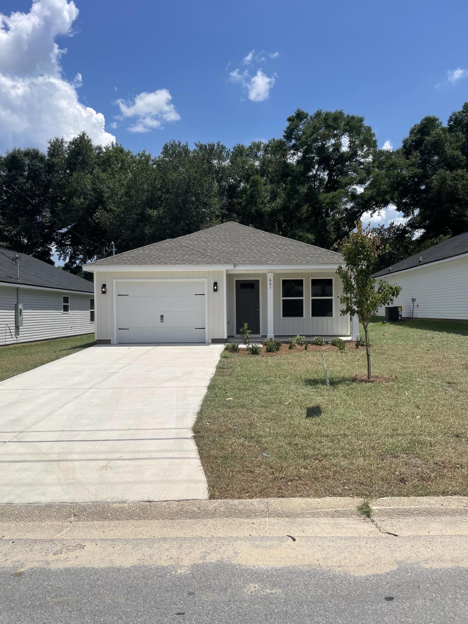 CONVENIENT MID-TOWN LOCATION - CONSTRUCTION COMPLETE- BUDGET FRIENDLY - All packed into the 'Scarlet' floor plan. Seller will contribute up to $10,000 towards buyers closing costs (call for details). Vinyl plank flooring throughout, landscaped yard, front & rear porches for relaxing, finished garage. Raised ceilings, recessed lighting, quartz work island w/bar seating, corner walk-in pantry, walk-in closet in owner's bath w/double vanities, large laundry room, ceiling fans thru-out, white shaker style cabinets. Photos of similar sold home, elevation will vary, interior/exterior colors & finishes will vary.