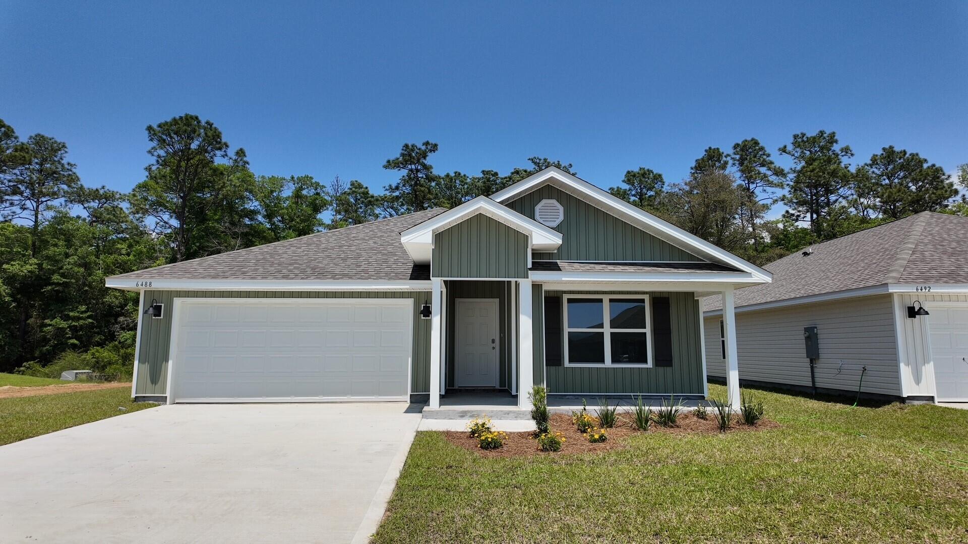 Welcome to Rivers Cove featuring a beautiful community pool and playground. The Cali model, one of our most sought-after designs, offers a fantastic open layout for relaxed living. Offers 4 bedrooms, 2 bathrooms, a covered back patio, 2-car garage, and the 'Smart Home Connect' System with various convenient Smart Home devices. The well-appointed kitchen includes stainless steel appliances, a smooth-top range, built-in microwave, quiet dishwasher, corner pantry, island bar, eye-catching wood-look flooring, and plush carpet in the bedrooms. Bedroom 1 and the adjoining beautiful bath boast a large walk-in closet, double vanity sinks and more. Fabric Hurricane window and door protection is also included. ALL LISTING pictures, colors, features, and size may vary. Square footages are approximate.