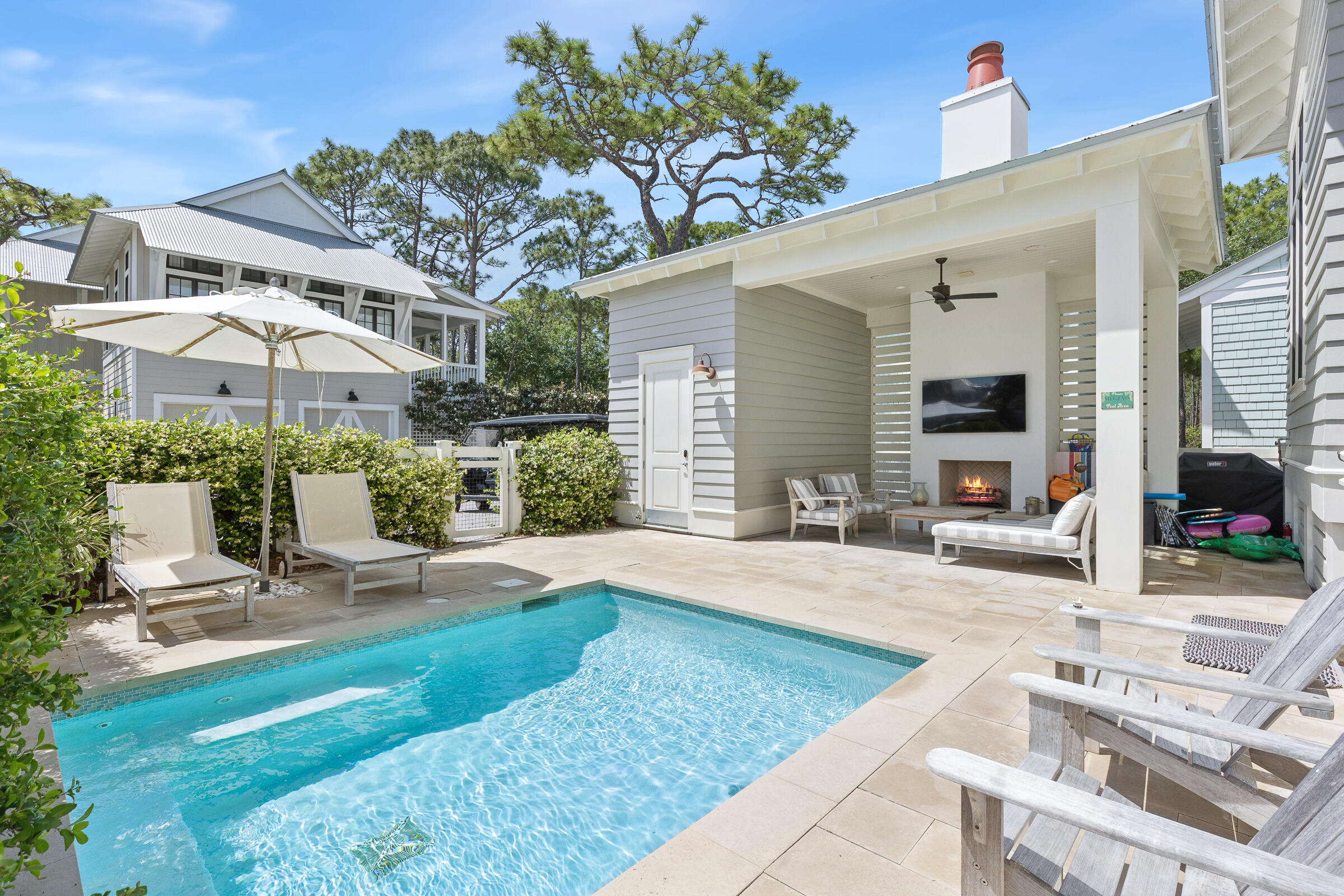 Located in the heart of WaterColor, this like-new coastal retreat at 17 Bluestem Lane offers the perfect blend of luxury, privacy, and the coveted WaterColor lifestyle. Thoughtfully designed with timeless finishes and impeccable craftsmanship, the home feels fresh, modern, and move-in ready.

Step outside to your own private backyard oasis featuring a sparkling pool, ideal for relaxing after a day at the beach or entertaining family and friends under the Florida sun. Spacious indoor and outdoor living areas create a seamless flow for coastal living at its finest.

Owners enjoy access to WaterColor's world-class amenities including multiple resort-style pools, private beach access, scenic walking and biking trails, tennis courts, parks, fitness facilities, and the vibrant Town Center with shopping and dining just moments away. Some of the special features include: Satina Brazilian Hardwood Decking, 12 foot ceilings with beautiful architectural beams, wolf/subzero appliances, 2 fireplaces, custom drapery, oversized laundry, pantry and professionally designed furnishings. Whether you're searching for a full-time residence, second home, or investment property, this exceptional home offers an unmatched opportunity to enjoy one of 30A's most sought-after communities.