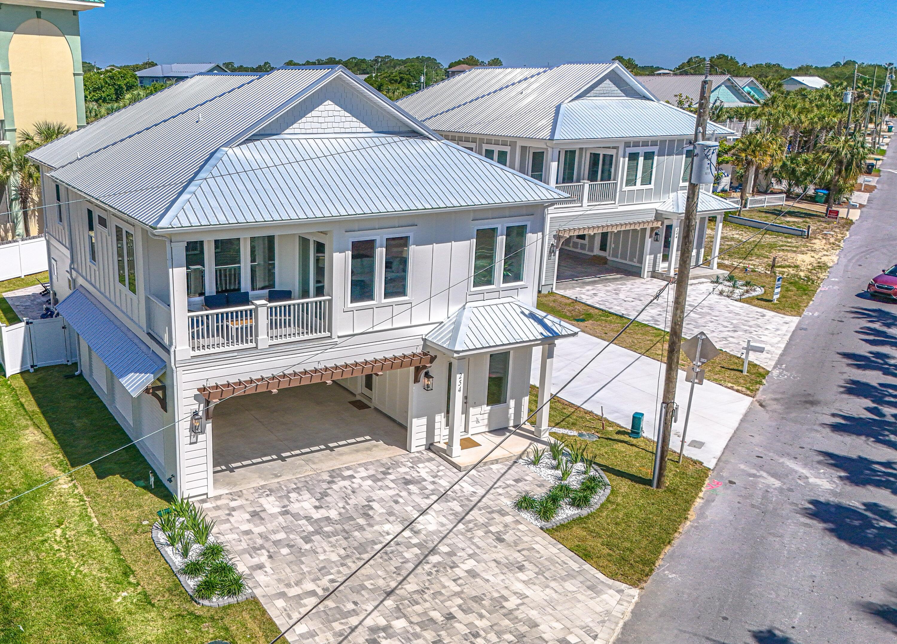 PRICE Reduction of 40,000 dollars! Home is now completed! Ready for Short-term Rental. Rental Projection of $178,000 annually, New Construction Coastal Retreat - Fully Furnished. Discover this beautifully crafted coastal luxury home, located on the highly desirable West End of Panama City Beach--just steps from the Gulf's most beautiful beaches. Completed, and tastefully decorated, this residence offers both a serene retreat and exceptional $178,000 Rental Projection per year of income-producing potential. This 5-bedroom, 4.5-bathroom home spans two stories with parking for 6 vehicles and designed for both comfort and sophistication. The chef's kitchen is a true showpiece, featuring upgraded stainless -steel appliances, including a French-door refrigerator, gas cooktop, dishwasher, and wall oven/microwave combination. Custom 42'' white shaker cabinetry, quartz countertops, and a spacious walk-in pantry complete this gourmet space. The open design flows seamlessly to outdoor living with a 12'x24' private saltwater pool, gas-heated for year-round enjoyment. Additional highlights include: " Gas tankless water heater " Hurricane-impact rated windows " Durable metal roof & Hardie siding " 8' interior and exterior doors " 10' ceilings on both levels A spacious game room that offers views of the pool, while multiple living areas provide plenty of space for entertaining. Conveniently located within walking distance to the pristine white-sand beaches, and just minutes to 30A, Pier Park shopping, dining, entertainment, and a short ride to local grocery stores, this home is the perfect blend of luxury and convenience. Whether as a private coastal escape or a high-yield vacation rental, this home presents a rare opportunity on the beautiful West end.