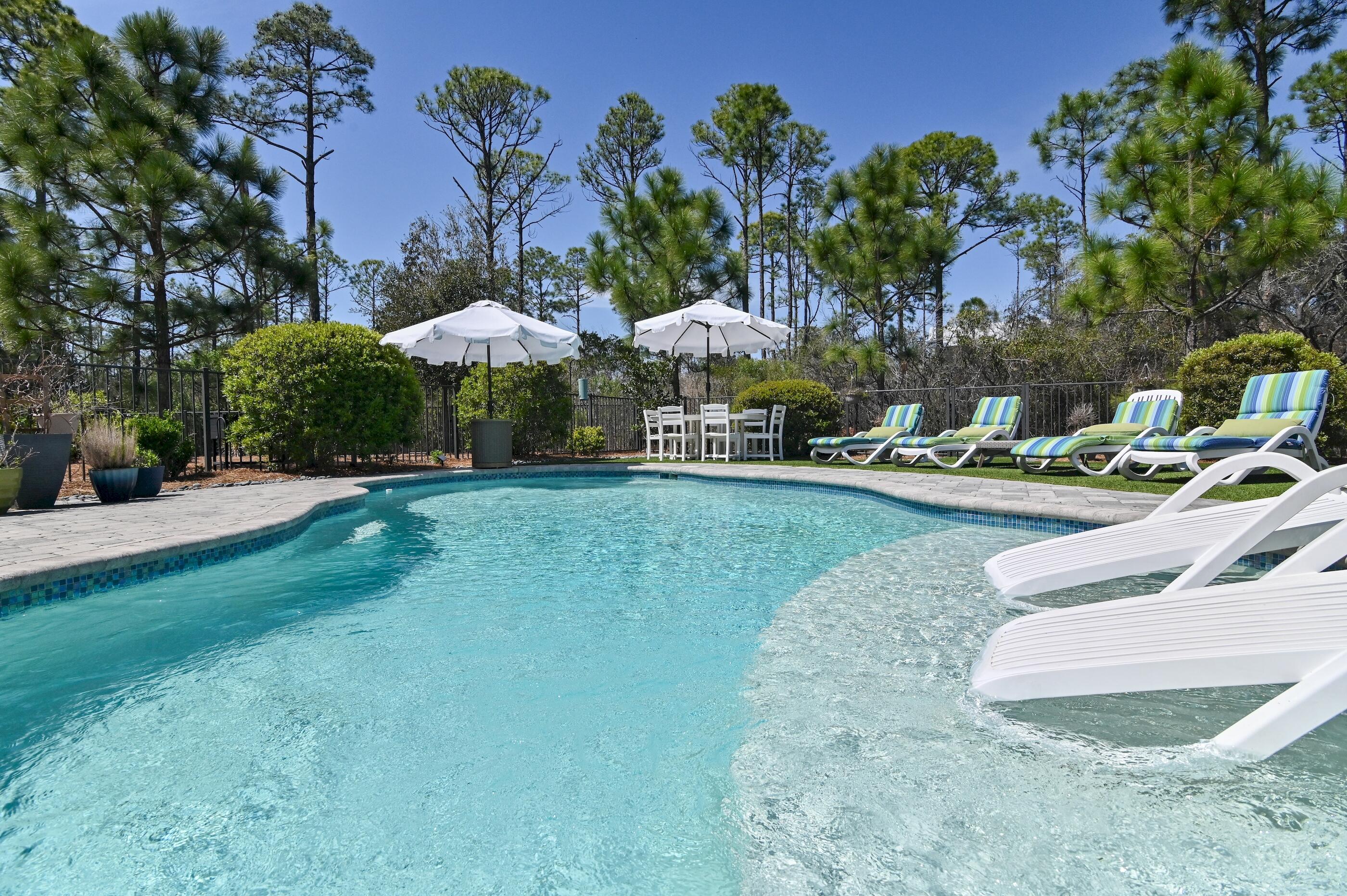 Create your own personal design touch and move in! Projected up to $130k gross annual rental income, just minutes from the beaches of 30A, Seaside, local dining and shopping. This home offers the perfect setting for a primary residence, second home, or short term vacation rental investment.
Located in NatureWalk at Seagrove along Scenic Hwy 30A, this 5-bedroom home with an additional flex space and second floor lounge sits on one of the largest homesites in the community and backs to a private wooded preserve. The home features a private heated saltwater pool, along with an expansive pool terrace, screened porch, offering ideal space for year-round relaxation and entertaining. Enjoy all the amenities and nature trails Naturewalk at Seagrove has to offer. Start living in paradise and make this 30A retreat yours.