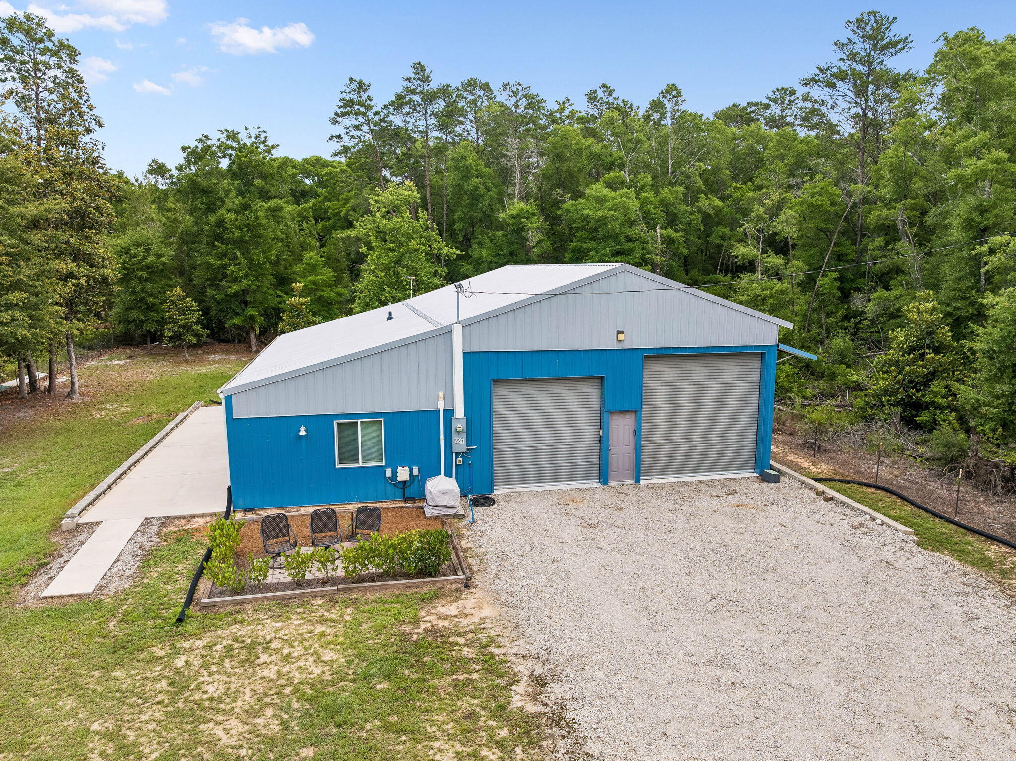 Rare find! This heavy-duty 1 bedroom/2bonus room/2 full bathroom home features 1,260 sq ft of living space (2,400 total sq ft) built on a monolithic slab with high-efficiency 2x6 spray-foam construction and 140-mph storm-certified windows and doors. The interior is open space, plentiful storage, 8-14' ceilings, solid wood kitchen cabinets, large laundry room. The ultimate 30x38x14' garage boasts a 12x30 storage loft, two hurricane doors (12x12 & 10x10), and a robust 200-AMP electrical service with two 100-AMP sub-panels. Boat or RV can be parked on the additional 12x50 concrete patio. Fully fenced backyard. Perfect for hobbyists, boat/RV owners, or anyone wanting .50 acre of land with lots of outdoor space.