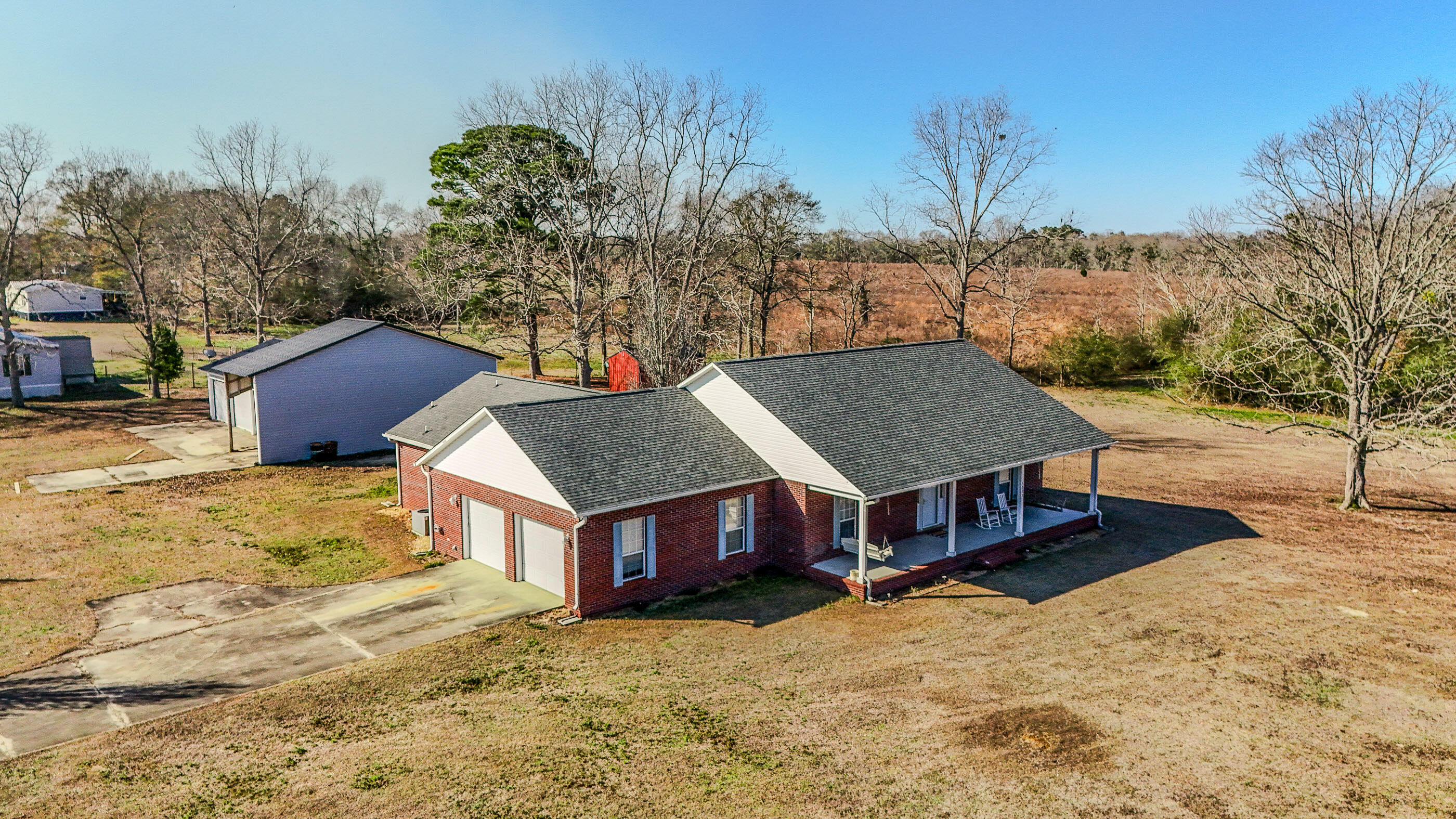 Beautiful brick home located in countryside of Florala with perfect access to Crestview and Eglin AFB - 3BR 2BA floor plan is GREAT! Welcomed by a covered front porch, large living room with vaulted ceilings and formal dining. Kitchen with white cabinets is functionable for any family and offers a breakfast bar and breakfast knock. Home master has a large BR, master BA with separate vanities, separate shower and tub and 2 walk in closets that also opens to a large utility room! The split floorplan offers 2 additional BRs and a full BA. Home includes a 2-car garage attached and also a great back patio for afternoon grilling. Home sits on 1.95 acres including a 32X30 workshop as well as attached covered RV hookup. Includes 2 additional storge sheds pecan trees and plenty of room to run.