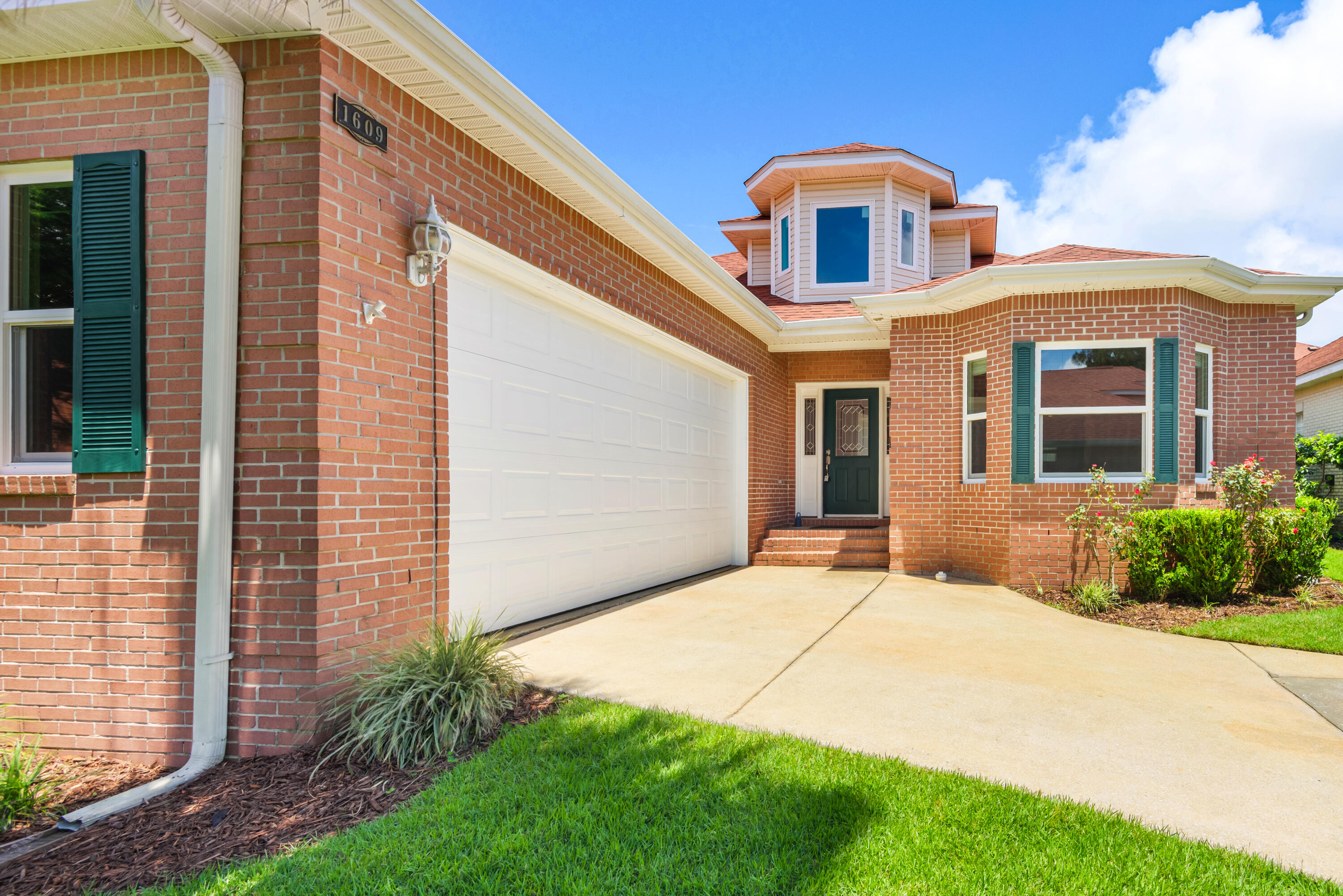This beautifully maintained 3-bedroom, 2-bath home combines timeless charm with thoughtful modern updates. A welcoming foyer with soaring ceilings creates an impressive first impression, while elegant tray ceilings add architectural character to the dining area.The spacious kitchen is designed for both everyday living and entertaining, featuring tall cabinetry, under-cabinet lighting, Corian countertops, a newer refrigerator (2021), dishwasher (2026), and disposal. The kitchen opens seamlessly to the inviting family room, showcasing vaulted ceilings, recessed lighting, wood-look tile flooring, a custom-tiled gas fireplace, built-in shelving, and a wet bar with wine cooler.The private primary suite offers a relaxing retreat with a spacious walk-in closet and an ensuite bath featuring dual vanities, a garden tub, and separate shower. Two additional bedrooms provide generous closet space and share a well-appointed guest bath.Major system upgrades provide peace of mind, including a roof (2020), energy-efficient windows (2025), HVAC system (2018), tankless water heater (2018), garage door and motor (2024), well pump (2024), refrigerator (2021), and dishwasher (2026). This move-in ready home offers the perfect blend of comfort, style, and updated functionality.