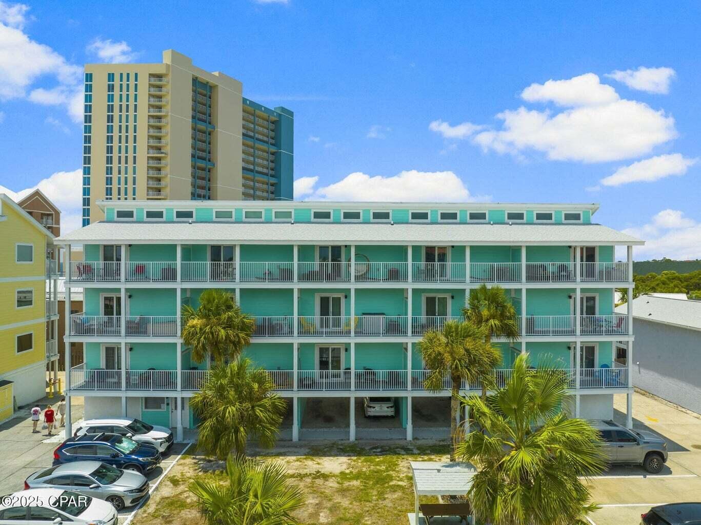 Welcome to Sand Castles West on the highly sought-after West End of Panama City Beach--just steps from the sugar-white sands and emerald waters and minutes from Pier Park's dining, shopping, and entertainment. This top-floor, fully furnished condo has been completely remodeled from the studs up and offers gorgeous Gulf views along with a true turnkey experience. Professionally designed by J Larae Designs, the interior features vaulted ceilings, recessed lighting, shiplap accents, and a bright, coastal-modern aesthetic throughout. No detail was overlooked with major upgrades including all new HVAC (inside and out), ductwork, electrical wiring and panel, insulation, drywall, Delta plumbing fixtures, Samsung kitchen appliances, GE laundry center, new pocket doors, and an added owner's closet. The exterior has also undergone a full renovation with new windows, sliding glass doors, balconies, Hardie board siding, walkways, stairs, and railings--with the $90K assessment already paid. Over $100K in interior improvements make this property stand out as essentially brand new. Enjoy community amenities including a sparkling pool, and easy beach access directly across the street. With proven long-term rental history already in place, this property is not only a beautiful coastal retreat but also a strong investment opportunity. Whether you're looking for a second home, full-time residence, or income-producing property, this one checks all the boxes. Schedule your private showing today.