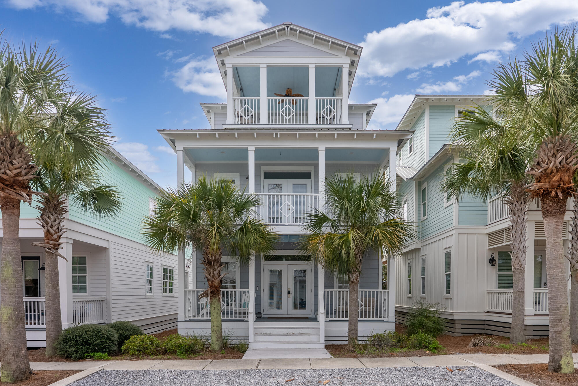 Nestled in the heart of the highly sought-after Seacrest Beach community, this beautifully updated three-story coastal retreat offers the perfect blend of timeless beach charm, luxury finishes, and an unbeatable location along Scenic Highway 30A. Spanning approximately 2,444 square feet, this four-bedroom, four-bath residence is thoughtfully designed for both relaxed family living and exceptional vacation rental potential.  

An inviting oversized front porch welcomes you into a bright, open-concept living space where natural light fills every room. The recently remodeled kitchen serves as the heart of the home, featuring premium appliances, abundant custom cabinetry, generous prep space, and a breakfast bar ideal for gathering after a day at the beach. The adjoining dining and living areas flow effortlessly for entertaining, while multiple covered porches extend the living space outdoors.

Designed with comfort and privacy in mind, each bedroom offers its own unique retreat. The spacious primary suite occupies the second level and features a private covered balcony, an oversized walk-in closet, and a spa-inspired marble bathroom complete with dual vanities, a soaking tub, and an oversized walk-in shower. Additional guest suites provide ample accommodations for family and friends, including a charming bunk room with its own ensuite bath. The crown jewel of the home is the third-floor rooftop viewing deck, where breathtaking Emerald Coast sunsets become part of your daily routine. Complete with a convenient wet bar, this elevated outdoor space is perfect for sunset cocktails, morning coffee, or evening entertaining beneath the coastal sky.

Perfectly positioned between Alys Beach and Rosemary Beach, this home places world-class dining, boutique shopping, and vibrant entertainment just moments away. Residents of Seacrest Beach enjoy exclusive access to one of 30A's largest resort-style lagoon pools, deeded beach access with seasonal tram service, scenic walking trails, and a gated community atmosphere that continues to make Seacrest one of the most desirable destinations on the Emerald Coast.  

Whether you're searching for a luxurious primary residence, a second home, or a premier investment property with proven rental appeal, 87 Endless Summer Way delivers the quintessential 30A lifestyle--where every day feels like a vacation and unforgettable memories are made just steps from the sugar-white sand and turquoise waters.