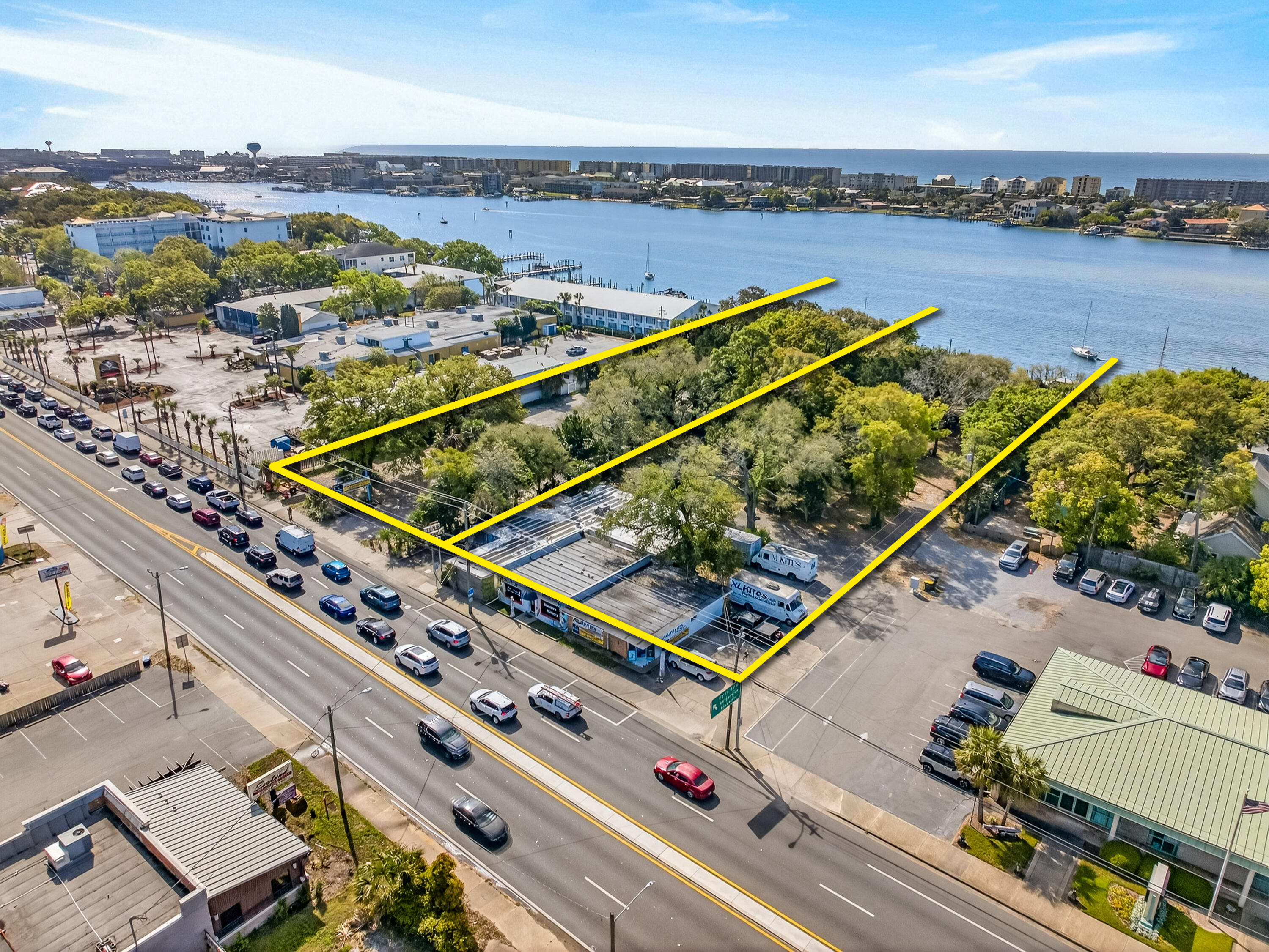 Extraordinarily rare waterfront assemblage favorably zoned ''MX-2 Mixed-Use'' (pursuant to City of Fort Walton Beach land development code) for high density redevelopment to achieve economies of scale involving a plausible host of viable development scenarios. Its prime ±248 fronting footage on the scenic Sound of Ft. Walton Beach, Florida, as well as ±248' along Miracle Strip Parkway, is within ±½ mile from the spectacular Brooks Bridge (under development and construction), as well as a pedestrian friendly, short walk to the historic downtown district of Fort Walton Beach, Florida. The combined total waterfront acreage is ±2.47, while the dimension of the two contiguous, combined parcels is as follows: 248' x 230' x 248' x 218'.  The assemblage is offered as-is, where-is, with no attributable value to the current structures onsite.  Buyer must verify zoning, potential development entitlements, riparian rights (dock / "marina") through the City of Ft. Walton Beach, Okaloosa County, and including but not limited to the Corp. of Engineers, and the FDEP.  Access to the property is strictly prohibited unless properly scheduled with advance notice through the listing agent(s).  Please inquire for additional information.  "MX-2 Mixed High Use" was defined as follows:  MX-2  Mixed-use (High Intensity) Zoning District. The mixed-use zoning district is established to provide for a wide variety of land uses, including multifamily structures, commercial and office uses, artisan studios, and cottage industries. Accessory uses for residential developments include onsite amenities, such as recreation facilities, carports, garages, storage buildings, parking lots, transit stops, and community buildings. Accessory uses for nonresidential developments include such onsite amenities as parking lots, parking structures, storage buildings, or transit stops. Open space in the form of plazas and courtyards may be provided. Waterfront locations may include accessory uses such as docks, boardwalks, or facilities for direct water access to support water-dependent uses. Uses within the MX-2 zoning district may be mixed within one (1) parcel or lot and may be mixed within one (1) building. The maximum density is thirty (30.0) dwelling units per acre. Bonus provisions may be authorized to allow a maximum density up to forty-five (45.0) dwelling units per acre. The maximum floor area ratio for nonresidential development is two (2.0) FAR. Bonus provisions may be authorized to allow a maximum floor area ratio of three (3.0) FAR.