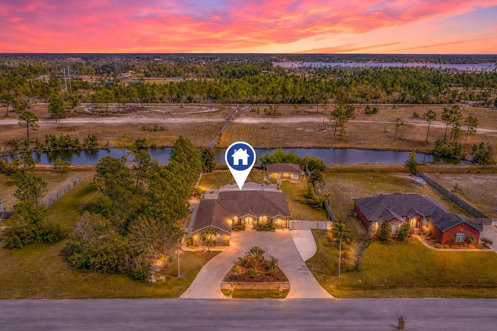 SELLER MOTIVATED - BRING ALL OFFERS! Beautiful custom home situated on over a half-acre lot in a quiet, private community of Kirkland Manor surrounded by natural spring-fed ponds.  Home is move-in ready and can close in 14-21 days. This thoughtfully designed home features an open floor plan with spacious living areas perfect for both everyday living and entertaining.
The primary suite offers a peaceful retreat with an ensuite overlooking the backyard and pool area. On the opposite side of the home, two additional bedrooms provide comfort and privacy for family or guests. A dedicated game area and wet bar just off the pool create the ideal setup for hosting and relaxing.  Plus an additional room for an office or work out area.
Step outside to enjoy true Florida living with expansive outdoor spaces, a sparkling pool, and plenty of room to unwind.  Enjoy fresh fruit from your garden of established fruit trees and bushes!                                      
The detached guest house with a separate entrance offers endless possibilities -- perfect for a studio, home office, private guest suite, or mother-in-law quarters.
Located in a highly desirable community known for its custom homes and scenic ponds, this property combines privacy and tranquility while remaining conveniently close to shopping, dining, schools, and everything the area has to offer.