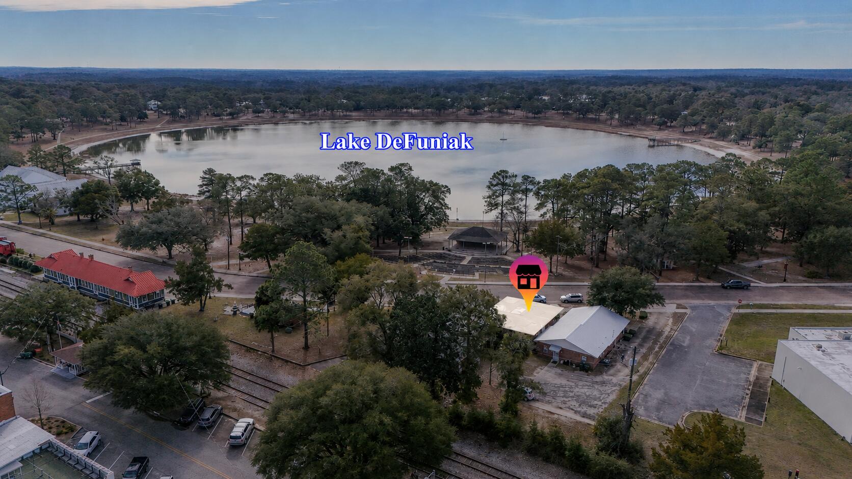 Rare downtown commercial lease opportunity in DeFuniak Springs, located at the front of the building with easy access and south-facing stunning views of Lake DeFuniak and steady natural light. This space is well suited for a studio, wellness concept, creative office, or professional practice seeking character and calm. The current layout includes a welcoming reception area, 4 or 5 additional offices or rooms, 2 bathrooms, plus storage space. The layout offers flexibility and can be reconfigured for the right use. Positioned in a vibrant downtown setting across from the lake and amphitheater, with exterior updates underway and refreshed photos coming soon. This is a natural second location for beach businesses ready to expand to a high-traffic  destination. Tenant is responsible for utilities, internet and phone.