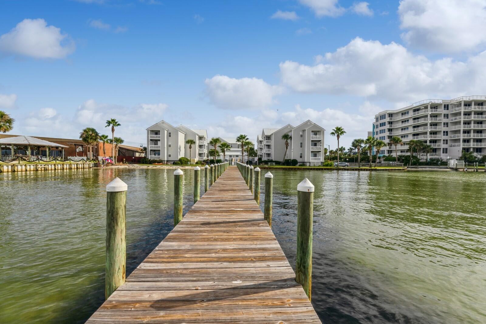 Best of both worlds on Okaloosa Island, the Beach and the Bay! Bay front community with stunning view of the Choctawhatchee Bay, including a small private sandy beach and a 300 ft fishing/boating pier. A community pool and picnic area are also included along the bay front. The beach is directly across the street with easy access to John Beasley Park, the Boardwalk, and the Okaloosa Island Fishing Pier. Convenient first floor condo with designated parking space directly in front of unit. Pool view and bay view from balcony.