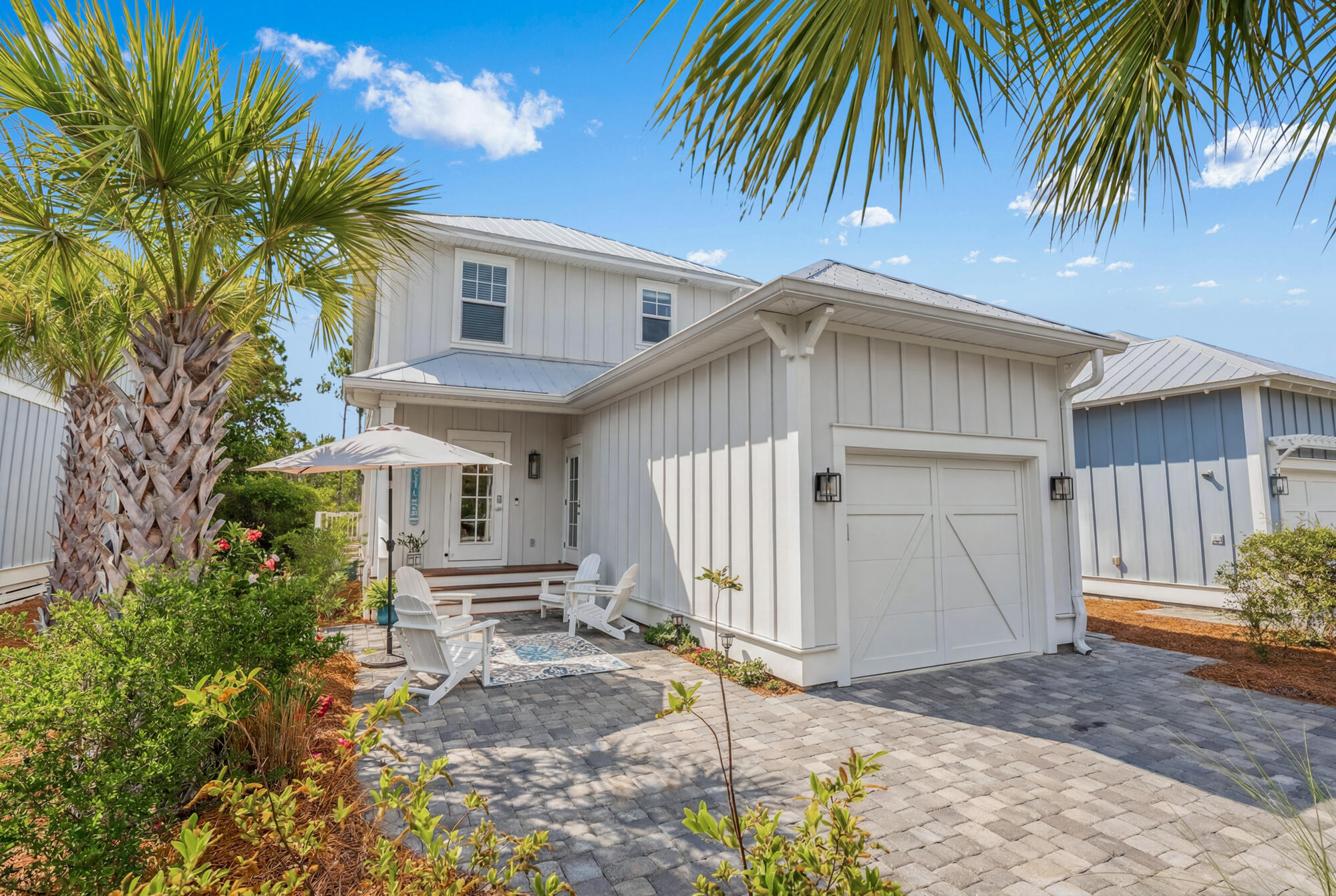 Rare main-level primary suite -- while most 30A homes stack all bedrooms upstairs, this floor plan puts the master on the main floor where it belongs. 4 bedrooms, 3.5 baths, open great-room, chef's kitchen with island and pantry, upstairs loft, and an oversized garage built for beach life. Non-rental community means real neighbors, not rotating strangers. HOA handles all lawn care, community pool is right across the street, and zero weekend chores stand between you and the good stuff. Topsail Hill State Park is right next door: miles of uncrowded beach, accessible by bike or free tram. No parking hassles. No crowded public access. Just Santa Rosa Beach and 30A the way it's meant to be lived.

Most people don't know about the beach access at Topsail until a local tells them. While public beach accesses along 30A fill up by 9am on a summer Saturday -- parking lots overflowing, chairs stacked shoulder to shoulder -- Topsail stays peaceful. Three miles of protected coastline, 25-foot dunes, and water so clear it doesn't look real. Ride your bike from the front door in about 15 minutes or walk over to the park entrance and hop the free tram down to the sand. A Florida State Parks family pass is $120 for the year. That's your beach access sorted, at one of the best stretches of Gulf Coast in existence. Welcome to 92 Heron's Crossing.

Pull up, and the first thing you'll notice is how easy this feels. No grass to mow, no landscaping to fuss with -- the HOA handles all of it. The palm trees and pine straw beds are tidy and well-kept, the street dead-ends just past your driveway. This isn't a cut-through. The people here chose to be here.

Step inside and the great room opens wide in front of you -- kitchen, dining, and living all connected in a way that just works, whether you're hosting a houseful of friends after a beach day or settling in for a peaceful evening with the windows open.

The kitchen anchors it all. Big island with seating, plenty of cabinet space, walk-in pantry. It's the kind of kitchen that makes cooking feel optional and entertaining feel effortless.

Just off the entry, a short hall leads you to the primary suite. On the main floor. In a part of the world where land costs push builders to go vertical, stacking every bedroom upstairs, this layout is genuinely rare. King bed, walk-in closet with custom storage, spa bath with double vanity and tiled shower. It's a retreat that actually feels like one.

Head upstairs and you've got three more bedrooms -- one with its own ensuite, two connected by a Jack-and-Jill bath -- plus a loft at the top of the stairs that becomes whatever you need it to be. Second living room, movie space, homework nook, overflow guest area. It earns its square footage.

The garage will make you smile. Tall ceilings, deep footprint -- there's room for bikes, paddleboards, a golf cart, and still space to actually park. Beach gear stays in the garage where it belongs, not tracked through the house.

Now let's talk about the neighborhood -- because this is where it gets good.

Heron's Crossing is one dead-end street. Twelve single-family homes on the north side, eight townhomes on the south. Non-rental community, 12-month minimum. The people around you are neighbors, not strangers rotating in and out every weekend.

And Topsail Hill Preserve State Park surrounds the neighborhood to the west and south -- not "nearby," right there. This is one of the most protected stretches of coastline on the Gulf, and it shows. Miles of beach. Twenty-five foot dunes. Water so clear it doesn't look real. On a Saturday in July, while the public accesses are a parking lot circus with chairs stacked shoulder to shoulder, Topsail is still peaceful. Still beautiful. Still yours.

Getting there is half the fun. Ride your bike over in about 15 minutes. Or walk to the park entrance and hop the free tram down to the sand. A Florida State Parks annual family pass runs $120 -- that's your beach access for the year, at one of the best beaches on the entire Gulf Coast.

The details that matter:

" 4 bedrooms, 3.5 baths -- 2,024 sq ft
" Main-level primary suite -- rare for this area
" Open-concept great room, kitchen with island and walk-in pantry
" Upstairs loft + 3 bedrooms (1 ensuite, 2 Jack-and-Jill)
" Oversized 2-car garage with tall ceilings
" Community pool directly across the street
" HOA covers all lawn maintenance, palm trees, and pine straw
" Non-rental community (12-month minimum)
" Topsail Hill Preserve State Park on the west and south borders
" Direct sidewalk connection to Topsail Hill State Park entrance
" Minutes from 30A dining, shopping, and bike trails
" Built 2019 by Cole Construction -- original owner, well maintained
