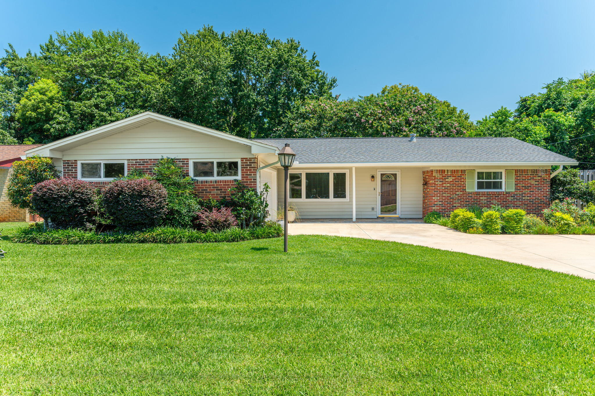 Welcome home to this beautiful all-brick ranch situated in a quiet, established neighborhood. From the moment you arrive, the expansive, manicured green lawn and massive driveway give this property incredible curb appeal.
Step inside to a bright, open floor plan featuring a spacious living area with beautiful wood floors, fresh neutral paint, and a sleek modern fixtures. The massive sliding glass doors flood the space with natural light and lead out to your own private backyard oasis, complete with a sparkling swimming pool and covered patio, perfect for entertaining. The house features 3 large, comfortable bedrooms, an updated open kitchen concept with a breakfast bar, indoor laundry, and an attached two-car garage. Best of all, you're just minutes away from schools, shopping, and the beach! All of the majors have already been replaced! Roof 2022, HVAC 2021, Impact Windows, Siding & Doors 2018