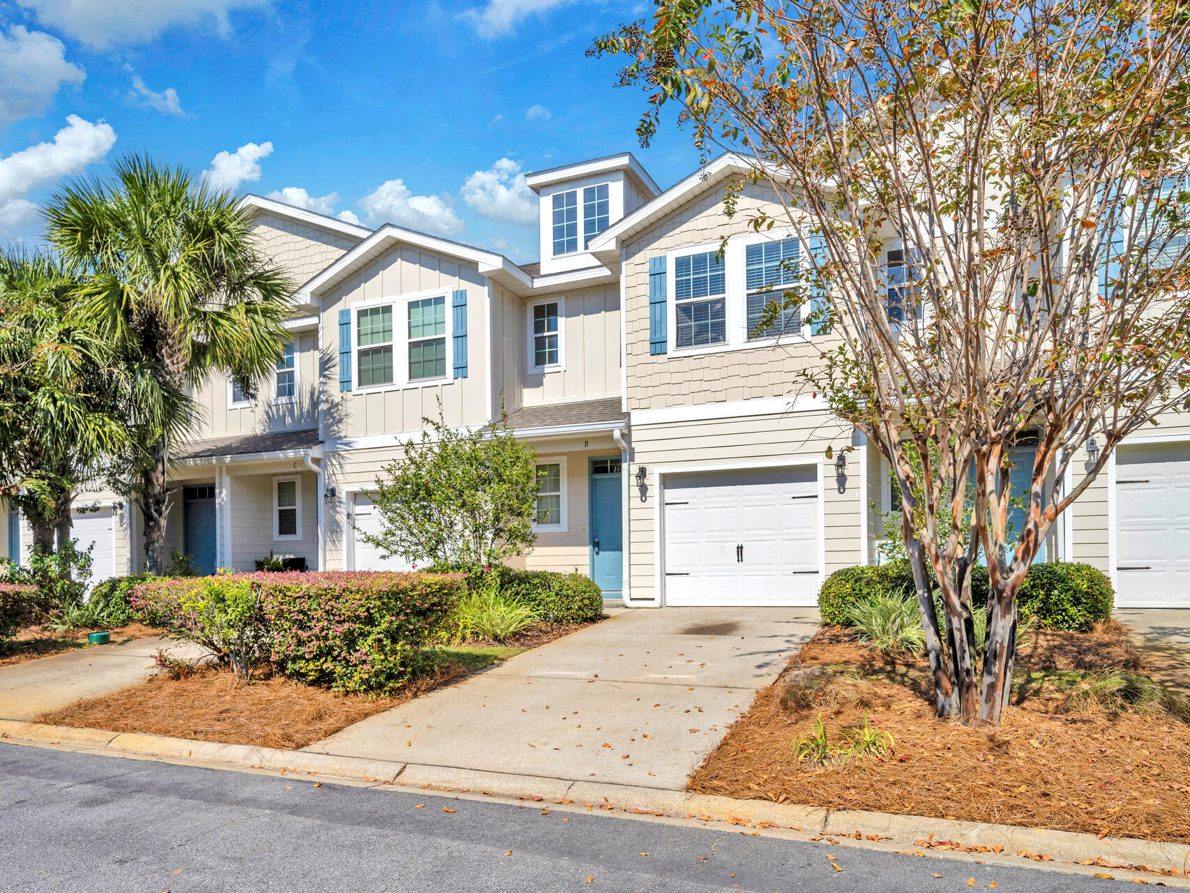 $10K PRICE REDUCTION! Seller is ready to sell! Welcome to effortless coastal living in the desirable Water Oaks community, where your HOA takes care of lawn care, landscaping, exterior maintenance, and insurance--freeing up your time for what matters most. Just minutes from the laid-back shores of Blue Mountain Beach and Topsail State Park, this freshly updated two-story townhome is move-in ready with all-new appliances, new carpet, and a freshly painted interior. The bright kitchen, featuring granite countertops, white cabinetry, and stainless steel appliances, flows seamlessly into the open living space, perfect for entertaining or relaxing after a day on the sand. Upstairs, you'll find a spacious primary suite, two additional bedrooms, a guest bath, and a convenient laundry area. The  tiled shower adds a touch of style, and the garage provides extra storage or parking. Located close to Point Washington State Forest hiking trails, local seafood spots, and four public beach access points, this townhome puts you at the center of the 30A lifestyle.