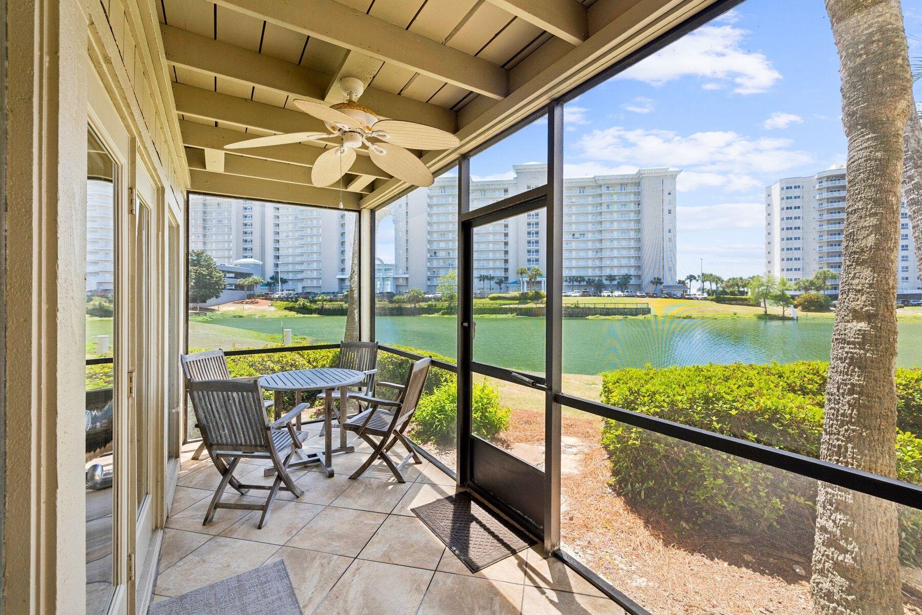 There is something especially appealing about a home that gives you water views in one direction and the beach just beyond them. Stewart Lake Cove 180 captures that ease beautifully, offering a serene lakefront setting within Seascape Resort and a location that places the best of Miramar Beach within easy reach. Positioned directly on Lake Stewart, this beautifully maintained three-bedroom, two-bath residence offers more than 1,261 square feet of thoughtfully arranged living space with two private screened balconies designed to make the most of peaceful lake views and glowing sunset skies. Inside, the interiors feel bright and relaxed with a clean coastal aesthetic, granite countertops, tile flooring in the kitchen and baths, plantation shutters and generous storage throughout. The floor plan is both practical and inviting, with one bedroom and a full bath on the main level and two additional bedrooms upstairs connected by a convenient Jack-and-Jill bath. Whether used as a primary residence, second home or investment property, the layout easily accommodates family and guests. Offered fully furnished and never rented, the home presents a rare turnkey opportunity in one of the area's most established resort settings. Mornings begin with coffee on the balcony overlooking the lake. Evenings end with sunset colors reflecting across the water. Just beyond the residence, a scenic boardwalk stretches over Lake Stewart toward the sugar-white sand, creating a picturesque walk to the beach. The neighborhood pool is less than a minute away, and parking directly in front of the unit makes arrivals and departures refreshingly simple. Set within gated Seascape Resort, owners enjoy access to more than 2,000 feet of private beach, over 500 acres of lakes and manicured grounds, championship golf, multiple pools, tennis and pickleball courts and miles of walking and biking trails. Dining, shopping and entertainment at Seascape Towne Centre are also just moments away. Comfortable, well-appointed and wonderfully positioned, this lakefront retreat offers an effortless way to enjoy coastal living in the heart of Miramar Beach.