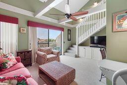Welcome To Your Own Beach Retreat! This Beautifully Updated 3rd Floor End Unit Offers 2 Bedrooms, 2 Full Baths Overlooking The Courtyard, (1) Of The Community Pools, Shuffleboard And Hot Tub. This End-Unit Location Provides Additional Windows Filling The Home With Abundant Natural Light. As You Enter You'll Find Tile Flooring Extending From The Foyer Through The Kitchen and Both Baths; The Living Area, Primary Bedroom, Staircase and 2nd Floor (Loft) Bedroom Feature Comfortable Berber Carpeting. The Kitchen Opens To The Living Area Through A Convenient Bar Pass-Through, Creating An Inviting Space For Entertaining And Everyday Living.  Additional Built-Ins And An Added 2nd Floor Storage Closet Provide Valuable Extra Storage Space Rarely Found In Similar Units. The 1st Floor Also Includes A Full Size Washer And Dryer For Added Convenience.  Tastefully Decorated With A Tropical Beach Theme, This Condo Truly Captures The Relaxed Coastal Lifestyle.   Located Directly Across From Public Beach Access 70 - Just Steps From The Beautiful White Sandy Beaches - You Can Easily Enjoy Sunrises, Sunsets And Days By The Gulf.  This Comfortable And Well-Maintained Unit Sleeps Up To (6) Guests With Two Bedrooms And A Pull-Out Sleeper Sofa Making It Ideal As A Vacation Home, Rental Investment OR Full-Time Residence. Whether You're Relaxing By The Pool, Enjoying the Beach OR Unwinding In Your Tropical Getaway. This Charming Condo Offers The Perfect Blend Of Comfort, Convenience AND Coastal Living.