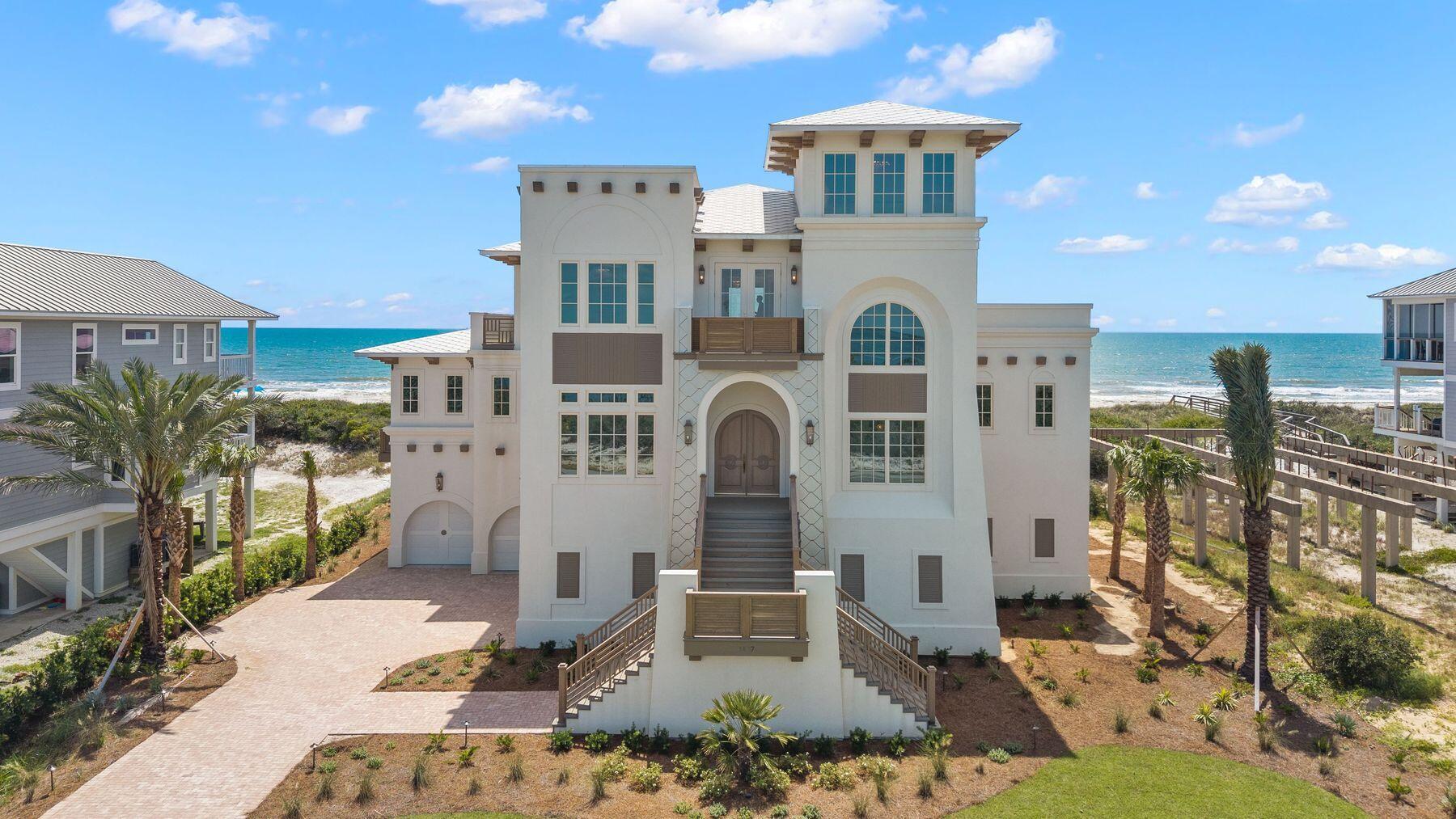 Some homes are purchased; others become part of a family's story for generations. Positioned on 100 feet of sugar-white gulf frontage and spanning an extraordinary 0.71-acre homesite, this custom-built estate represents one of the most significant residential offerings ever brought to Cape San Blas. Created as a private legacy retreat rather than a speculative build, every decision reflects an unwavering commitment to craftsmanship, architectural integrity and materials sourced from around the world. With nearly 5,000 square feet of living space, sweeping gulf and bay views and direct private beach access, opportunities of this caliber are exceptionally rare. 

Designed for both grand entertaining and everyday comfort, the residence offers four spacious bedrooms, a dedicated office, two separate living areas, four luxurious ensuite bathrooms and three additional half baths, including a convenient pool and beach bath just inside the garage entry. An elevator provides seamless access to three levels, while soaring 12-ft. ceilings on the main floor and 10-ft. ceilings upstairs create remarkable scale and natural light throughout.

At the center of the home, an extraordinary chef's kitchen pairs timeless design with professional performance. A spectacular 10.5-ft. single-slab island anchors the space alongside dual Thermador refrigerators, premium BlueStar, Cafe and Thermador appliances, custom cabinetry, a butler's pantry and a dedicated coffee bar. Entertaining continues with an elegant wet bar and a temperature-controlled wine cellar highlighted by remarkable 10-ft. handcrafted doors imported from Egypt. Custom antique gold hardware, in-cabinet and under-cabinet lighting and beautifully crafted cabinetry extend consistently through the kitchen, baths, bar and wine room.

Every finish was selected without compromise. Richly stained woodwork, white oak stair treads, hand-carved reclaimed-wood corbels, and oversized 12-in. baseboards showcase exceptional craftsmanship throughout the residence. Imported Italian tile flows from room to room while the bathrooms feature breathtaking large-format slabs measuring up to five by 10 feet, including dramatic book-matched installations completed by a specialty tile team brought in from Miami specifically for this project. Swiss Madison in-wall toilets, custom chandeliers and LED cove lighting further elevate the home's refined aesthetic.

Walls of impact-rated glass frame panoramic coastal views while creating an effortless connection to the outdoor living spaces. A screened gulf-front porch centers around a gas fireplace and a fully equipped outdoor kitchen complete with a gas grill, sink and refrigerator. Just beyond, the heated and chilled pool and spa overlook the beach, creating a true resort experience in every season. A private boardwalk leads directly to the sand while an outdoor shower makes returning from the beach effortless.

The home's thoughtful infrastructure is every bit as impressive as its finishes. A whole-house generator, Starlink internet, EV charging station, integrated whole-home audio, security camera system and dual laundry rooms with separate workstations on each floor provide modern convenience without sacrificing luxury. Air-conditioned garages and storage areas offer practical functionality seldom found in waterfront homes.

T.H. Stone Memorial St. Joseph Peninsula State Park nearby offers one of the Forgotten Coast's most spectacular natural settings. Miles of protected shoreline, world-class fishing, scalloping, boating, kayaking, and uncrowded beaches create an atmosphere that has become increasingly difficult to find along Florida's coastline. Here, remarkable privacy and breathtaking scenery exist in perfect balance with easy access to Port St. Joe's dining, shopping and marina.

Built to stand apart from every other home on Cape San Blas, this is more than a luxury residence. It is a once-in-a-generation opportunity to own a custom gulf-front estate whose quality, craftsmanship and legacy potential simply cannot be duplicated.