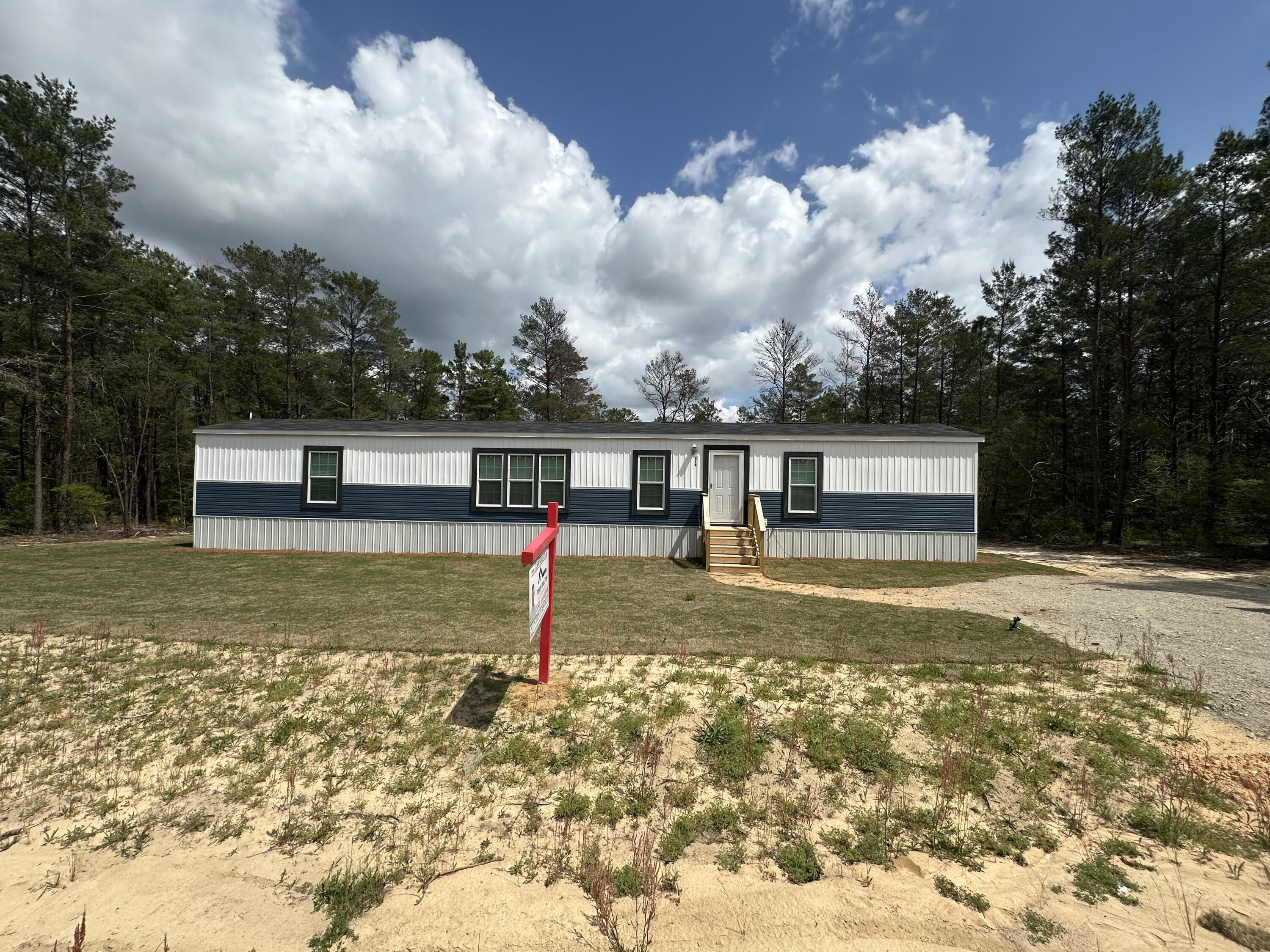 Have you been looking for an affordable new home within an hour of the Gulf Coast and the world's most beautiful beaches? Well, look no further, this beautiful, brand-new 3-bedroom 2-bath manufactured home might be just what you are looking for. Complete with all-new Whirlpool appliances, HVAC, and a water heater, this home is move-in ready. An added bonus is that the seller is willing to offer owner financing (with the right down payment and terms). Sitting on over 0.6 acres, this property offers potential for the investor, with a spacious backyard that has already been surveyed and shows where it can be split into three individual lots. So, whether you are looking for a forever home or an investment opportunity, come check this out and see if this property is right for you.