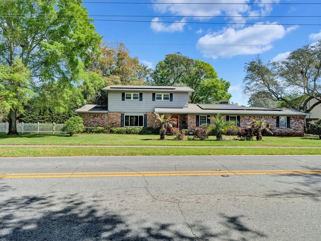 Looking for a 2.625% interest rate, ask details about this VA assumption. This beautiful two-story home features four bedrooms and two and a half bathrooms, with real hardwood floors, crown molding, and plantation shutters throughout the main level. The kitchen is equipped with soft-close cabinets and a gas stove, a pantry offering plenty of storage and workspace. The heated and cooled sunroom is perfect for enjoying all seasons, with a double-zoned HVAC for the remainder of the house. 
Bonus: there is Tesla charger in the garage and paid-off solar panels to help provide modern convenience. Plenty of space for entertaining, with a formal living room and dining room, sitting room, family room, and rec room/office space, the potential to create an in-law suite if desired. 
Conveniently located near Eglin AFB, Hurlburt Field, the beaches, and shopping, this home perfectly combines comfort, space, and the best of Emerald Coast living.
