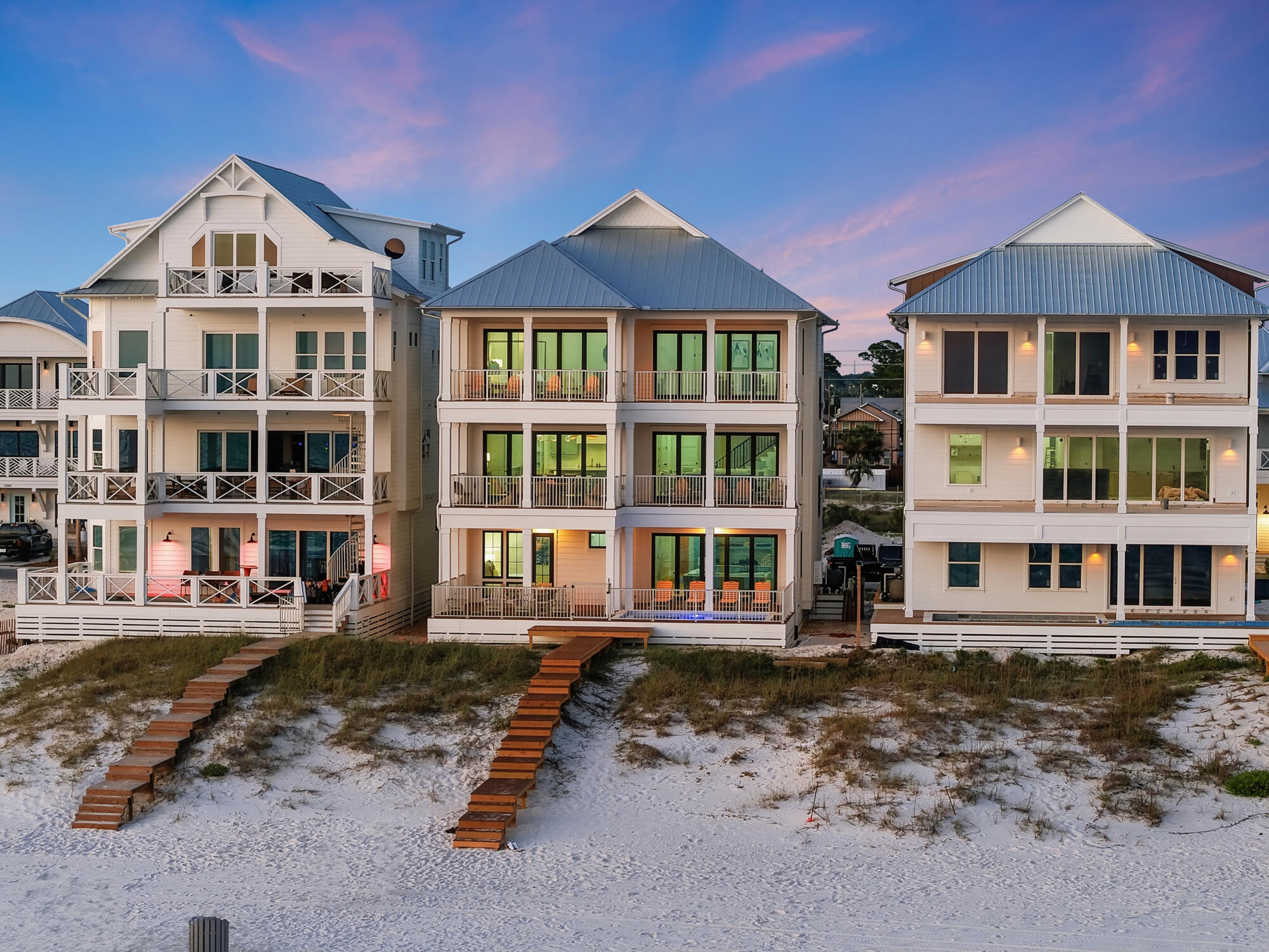 Set along the sugar-white shoreline of Panama City Beach, The Headliner at Hadley's Beach presents a rare opportunity to own one of the limited Gulf-front residences within Hadley's Beach, an intimate enclave of just 20 homes. With only 10 true Gulf-front residences in the community, this newly constructed offering represents one of the final opportunities to secure direct waterfront ownership in a setting designed for both elevated coastal living and exceptional investment potential, with short-term rentals permitted.
 Positioned moments from the energy of Panama City Beach's celebrated dining, live music, and entertainment scene, the home offers the rare balance of privacy and connection. Owners and guests can enjoy evenings filled with waterfront concerts, local music venues, and vibrant coastal culture before retreating to the serenity of their own Gulf-front escape.

Spanning 5,662 square feet across three thoughtfully designed levels, the residence by Thor Construction & Design blends refined coastal architecture with modern luxury. Floor-to-ceiling windows frame uninterrupted Gulf views, drawing natural light throughout the interiors while showcasing the ever-changing blues of the water beyond. Just beyond the back door, private access leads directly to the white sand and turquoise shoreline, creating a seamless transition between home and beach.

The residence offers eight spacious bedrooms and eight bathrooms, carefully arranged to accommodate both large gatherings and quiet retreat. The second level serves as the heart of the home, where expansive living and dining spaces flow effortlessly into a chef's kitchen designed for entertaining against a backdrop of panoramic Gulf views. Clean architectural lines, elevated finishes, and generous proportions create an atmosphere that feels sophisticated yet inviting.

Occupying the upper level, the primary suite offers a private sanctuary overlooking the Gulf, complete with its own lounge area designed for peaceful mornings, sunset views, and evenings accompanied by the distant rhythm of the coast's live music scene.

Outdoor living is equally exceptional, with more than 1,300 square feet of porch space designed for open-air dining, relaxed conversation, and uninterrupted waterfront vistas. A private pool offers another space to unwind after a day on the beach, while the home's elevator and garage provide effortless convenience.

Offered fully furnished, The Headliner at Hadley's Beach is curated for immediate enjoyment. With direct Gulf frontage, refined construction, and proximity to the very best of Panama City Beach's coastal lifestyle, 5935 Gulf Drive is a statement residence where luxury, leisure, and the soundtrack of the Gulf Coast come together beautifully.