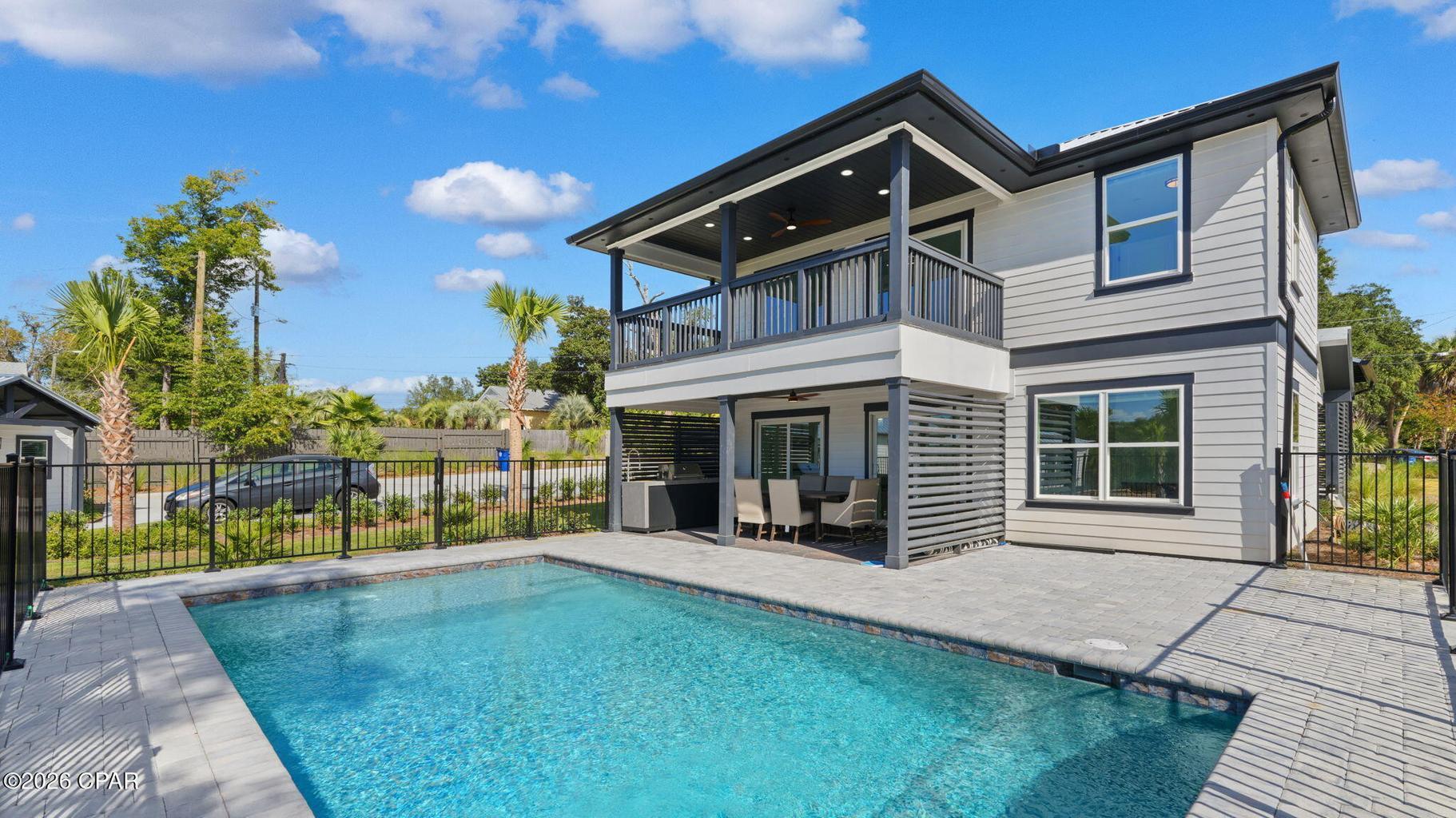 ATTENTION!! 3 SEPARATE STRUCTURES, 2 SEPARATE PARCELS, 1 AWESOME PRICE!! Zoned for short term and long term rental. Waterfront on Massalina Bayou! Main House: Amazing 3-bedroom 2-bath with den/office *new construction*. Gorgeous views from covered porches on both floors. First floor has open kitchen with Forno Italian stainless appliances, large Island, gas stove, double door refrigerator w/ice maker and wine cooler. Living/dining walk out large sliding doors to covered porch, outdoor Thor stainless summer kitchen and pool/bayou views.
Master bedroom and master bath with large custom shower, double vanity sink and walk in closet. Second floor open family room, den/office, large sliding doors to walk to walk out to covered porch overlooking pool/bayou. Two additional bedrooms and one bath. So much to offer with beautifully designed tile flooring throughout, tankless water heater and extra storage. 401 Massalina Drive is under a lease for 5 months with potential for 2 month extension. $3600 per month and includes utilities and pool service.
 405 Massalina Drive: Carriage House plus Quadplex/Fourplex: $7100 per month or $85,200 per year in rental income from the carriage house and quadplex/fourplex. Perfect for a DSCR loan where your rental income pays for your mortgage, plus you get a dock and a place to park your boat on deep water. This is the most versatile quadplex/fourplex plus carriage house (comes fully furnished) in Panama City. Here is the rental income breakdown: Carriage house = $1750 per month; Apartment 1 (Civil Contractor) = $1450 per month; Apartment 2 (Realtor) = $1450 per month; Apartment 3 (Property Maintenance Man) = $1,000 per month (reduced because he takes care of the lawn and pool - you could charge $1450); Apartment 4 (Josh) = $1450 per month; Total income = $7100 per month or $85,200 per year. New custom landscaping and pool to relax and enjoy. Beautiful decking, shared dock with fish cleaning station. Location is easy to access to newly renovated downtown entertainment with shopping, dining, concerts and ongoing festivities.