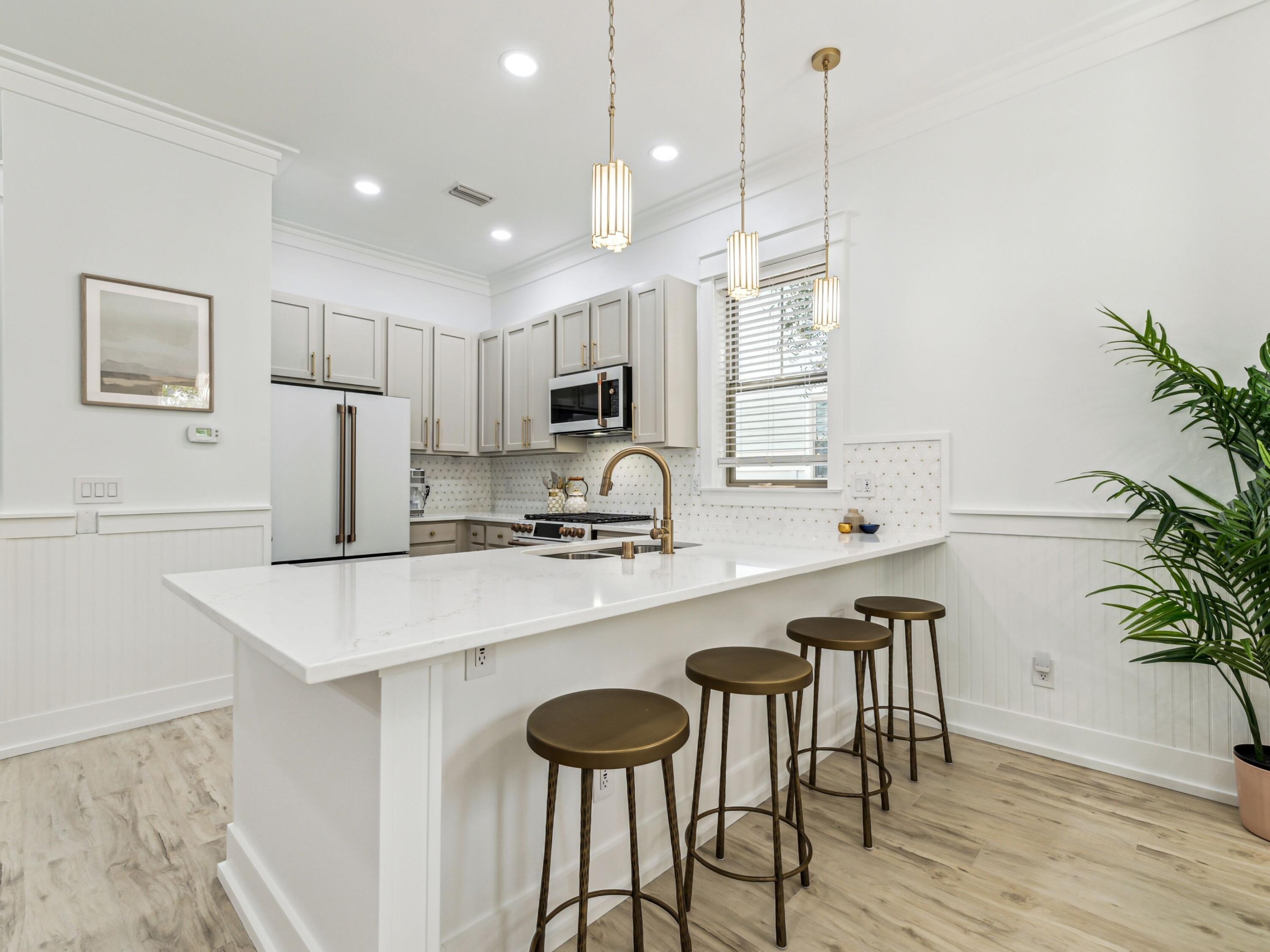Tucked within the tranquil Grayton Cove community in iconic Grayton Beach, this beautifully reimagined five-bedroom, four-bathroom retreat offers an exceptional blend of style, comfort, and location as well as PROVEN RENTAL INCOME with projections achieving up to 105K in annual revenue. With a six-seater golf cart and convenient tram access to multiple beach entry points, enjoying the sugar-white sand and emerald waters is effortlessly within reach -- while the community pool, just steps away, offers a tranquil retreat with ample seating and shaded lounging areas.

Fully renovated and professionally furnished by Jenn James Designs, the home showcases modern coastal elegance with striking accent walls, curated color palettes, and thoughtful upgrades throughout. Standout features include a stone fireplace, beautifully updated tile bathrooms, and a refreshed kitchen that serves as the heart of the home featuring Café appliances, white quartz countertops, and a refined neutral palette that flow out to a back deck space with Blackstone Grill for easy grilling and entertaining. 

Your private golf cart makes it easy to explore the best of Grayton Beach and nearby 30A favorites. Cruise to beloved local spots such as Black Bear Bread Company, Hurricane Oyster Bar, Chanticleer Eatery, Beignets & Brew, AJ's, Chiringo, and the iconic Red Bar -- all just minutes away.

Whether you're searching for a primary residence, second home, or investment property, this turnkey offering delivers both lifestyle and convenience in one of 30A's most desirable communities.