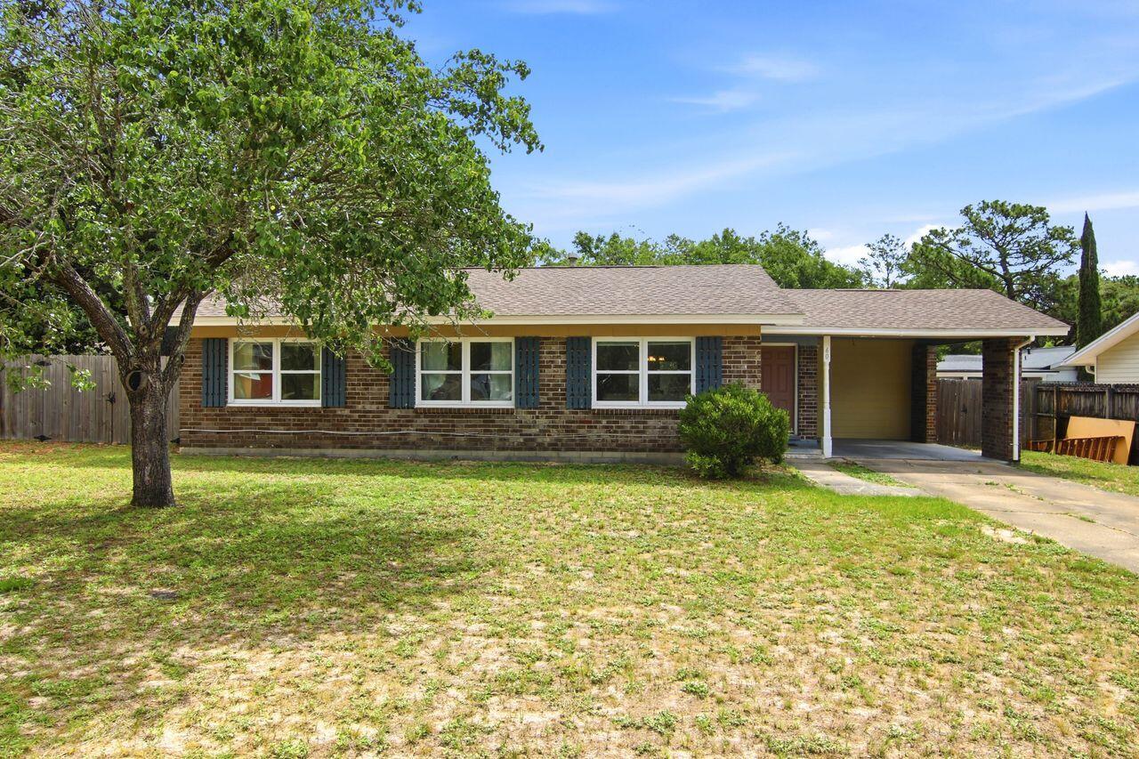 Great Investment or Starter Home in Shalimar! Solid block/brick Port Dixie home. This three-bedroom, two bath home was purchased in 2017 and taken down to the studs for a full interior renovation. Kitchen upgrades included quart counters and a full stainless steel appliance package. A shower was added to the design of the master bathroom for full function. A screened back porch and a large storage addition, plus a roomy laundry round out the interior. Add the level fenced backyard and no HOA to it and it is a no-brainer deal.