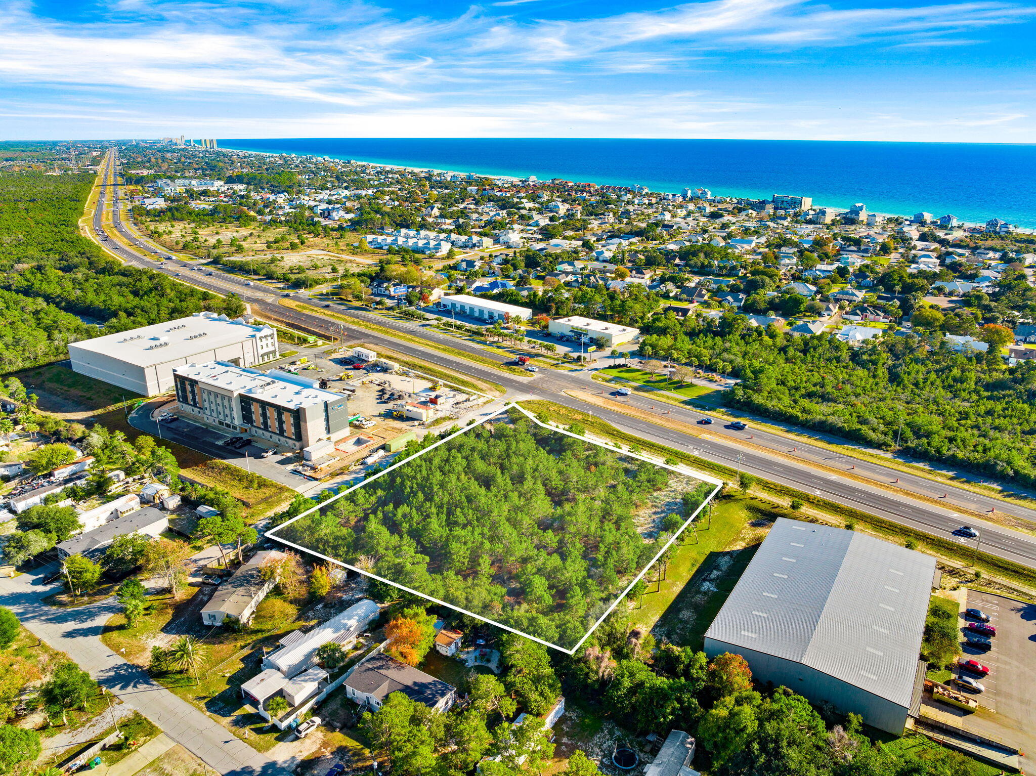 This 1.01-acre parcel sits on the rapidly growing west end of Panama City Beach, offering exceptional visibility and a daily traffic count of roughly 30,000 vehicles. With a convenient median cut providing full access, the site is perfectly positioned for high-impact commercial development. Nearby landmarks include the gated golf community of Wild Heron, Publix, and Phillips Inlet leading to scenic Highway 30A. The area continues to expand with new residential and retail growth, including the recently completed Vintage at Lake Powell community featuring approximately 20,000 square feet of vibrant restaurant and specialty retail space. This location places the property at the center of one of the most promising corridors in the market.