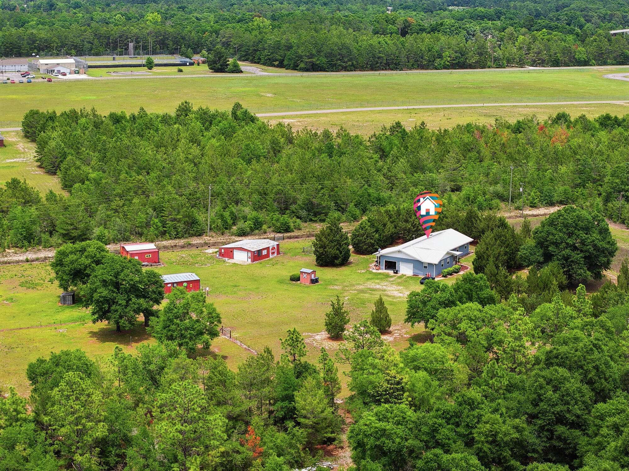 Hobby Farm Retreat -- Live the Self-Sufficient Lifestyle. Just minutes from town! This beautiful 5-acre hobby farm is fully fenced and cross-fenced, making it ideal for livestock, gardening, and sustainable living. Raise your own vegetables, chickens, and beef The property features multiple garden areas, lush pastureland, and an in-ground irrigation system covering nearly 50% of the property. The BR/2BA home is approximately 1,856 SF. with laminate flooring throughout, a smart layout,  Perfect for country living. Outside improvements include: 30x30 main barn, 18x21 hay barn, 21x24 chicken coop. Whether you're looking for a peaceful homestead, hobby farm, or a place to enjoy a more sustainable lifestyle, comfort and country charm.  24 hours' notice mandatory to show
